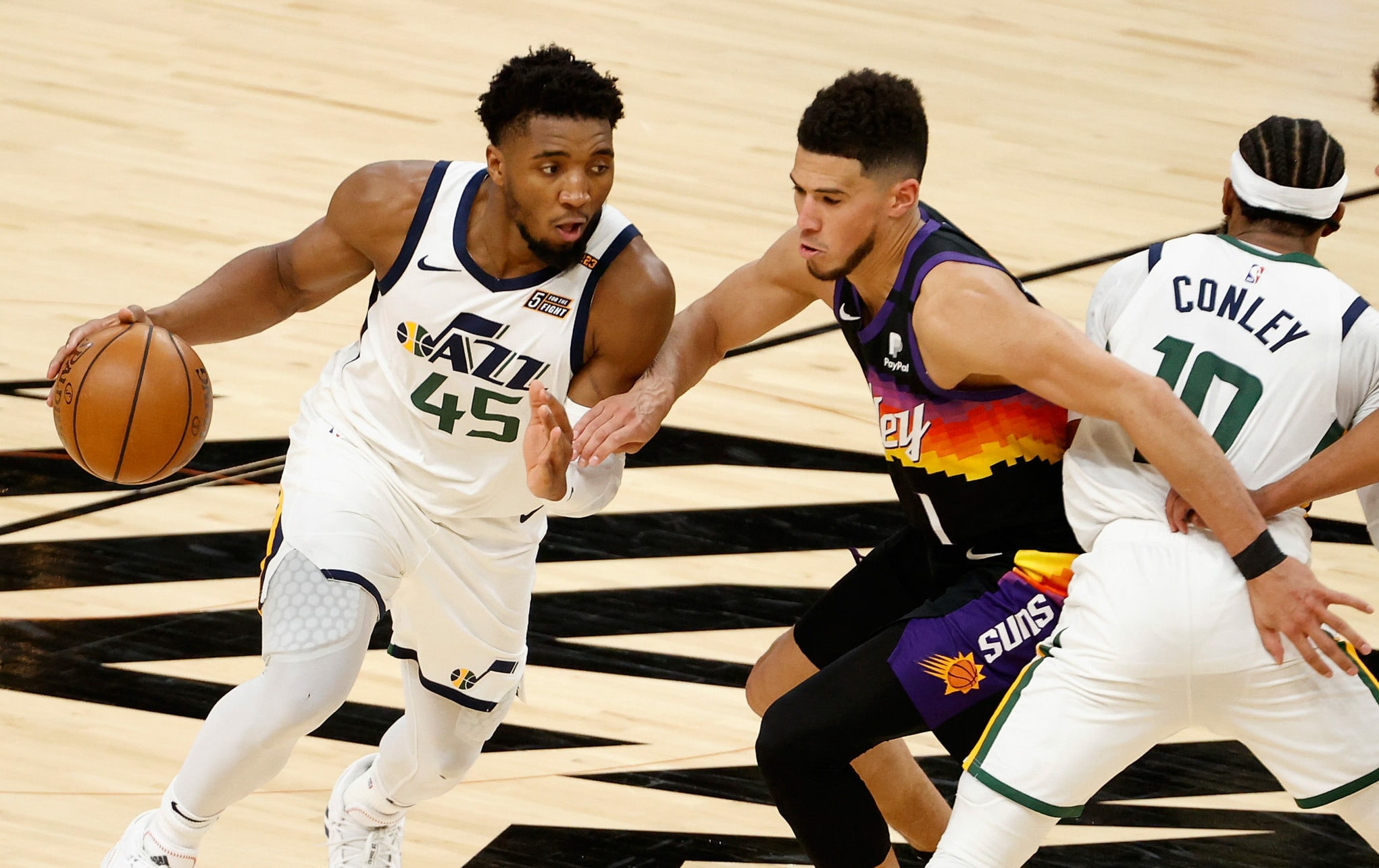 booker-defends-jazz-scaled-e1617897717122.jpg