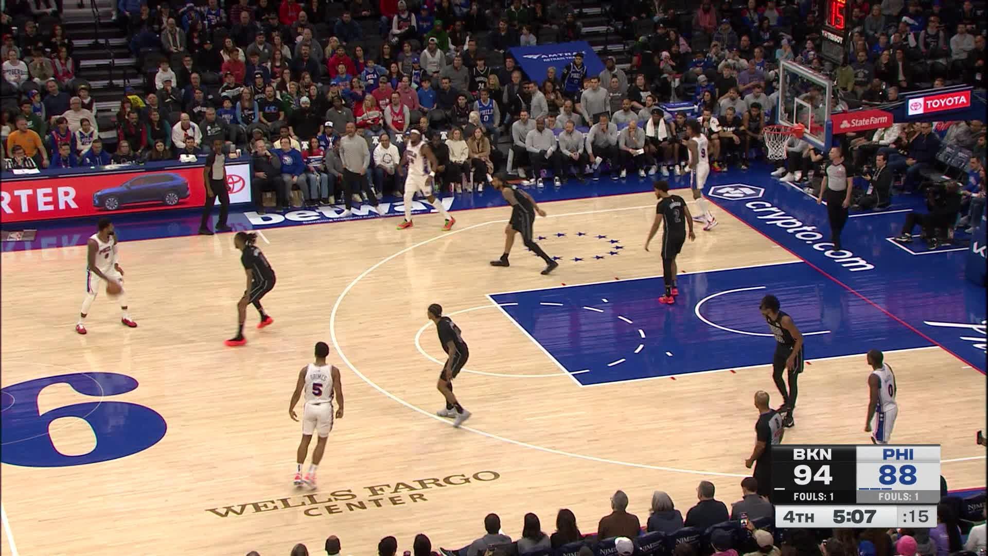 Paul George muscles to the basket and scores off the glass