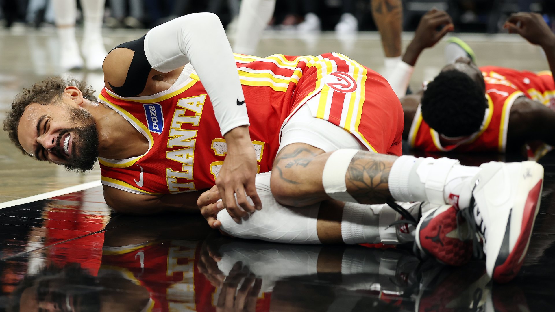 Hawks' Trae Young suffers sprained right knee vs. Nets