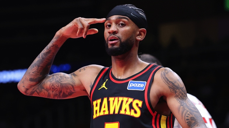 Nickeil Alexander-Walker #7 of the Atlanta Hawks reacts after hitting a three-point basket.