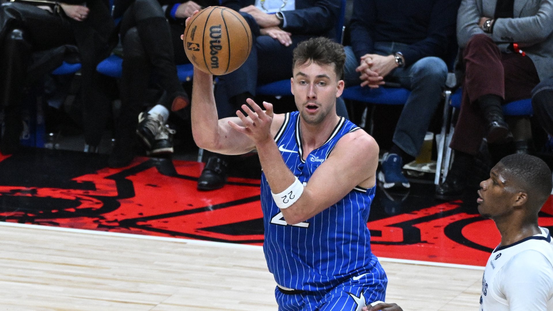 A wide shot of the basketball court inside The O2 Arena in London during an NBA game.