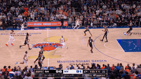 Josh Hart and Mikal Bridges hold the ball