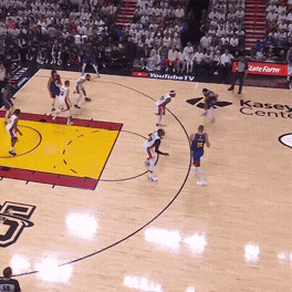 Nikola Jokić hands the ball off to Jamal Murray at the top of the arc in the 2023 NBA Finals, screening Jimmy Butler to get him free for a 3-pointer.
