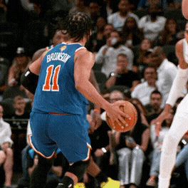 Jalen Brunson pulls up for a jump shot over Victor Wembanyama.