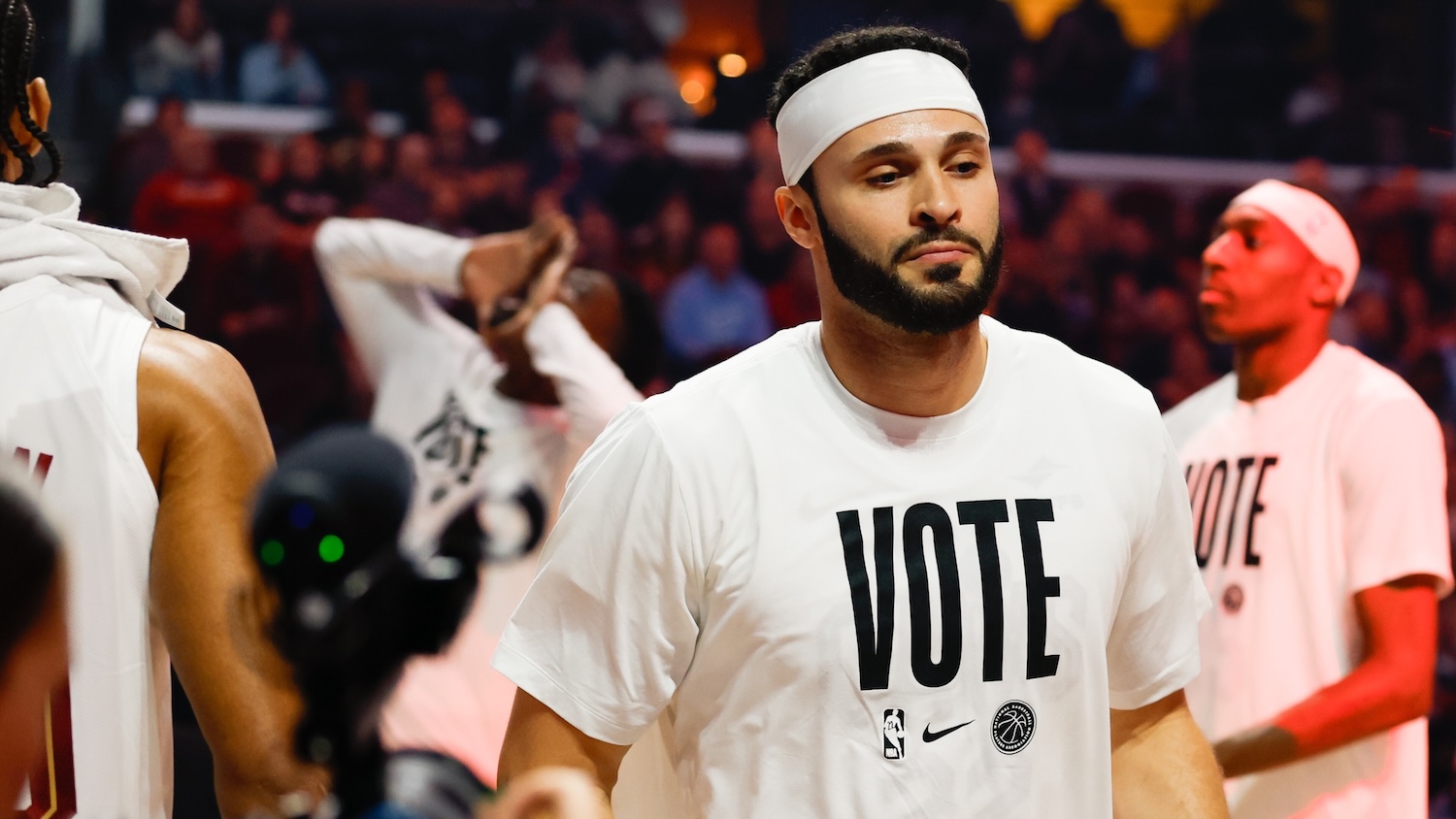 Larry Nance Jr. of the Cleveland Cavaliers is introduced before a game against the Atlanta Hawks at Rocket Arena in Cleveland, wearing a white “VOTE” T-shirt.