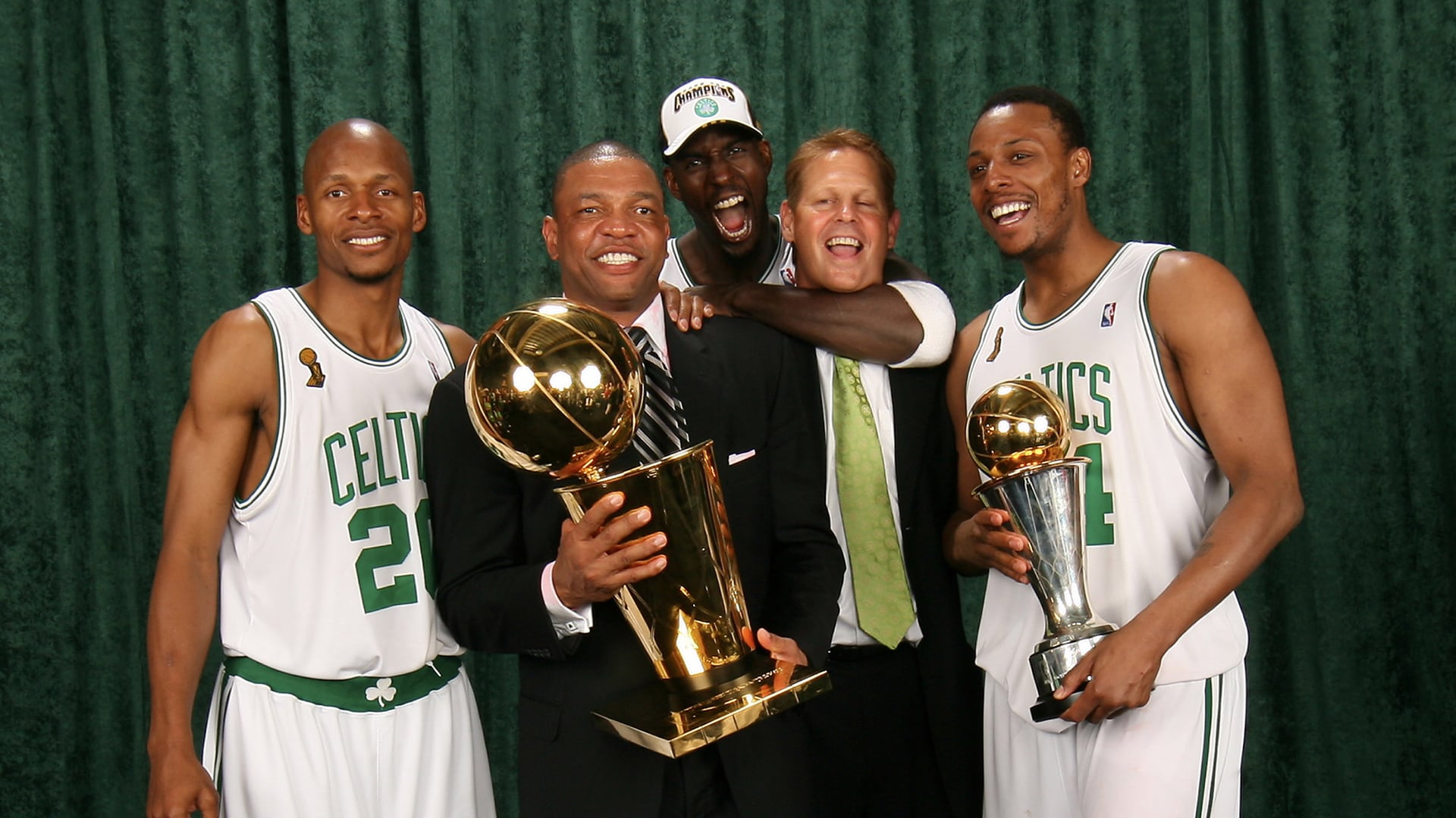 Doc Rivers takes photos with the Larry O’Brien Trophy