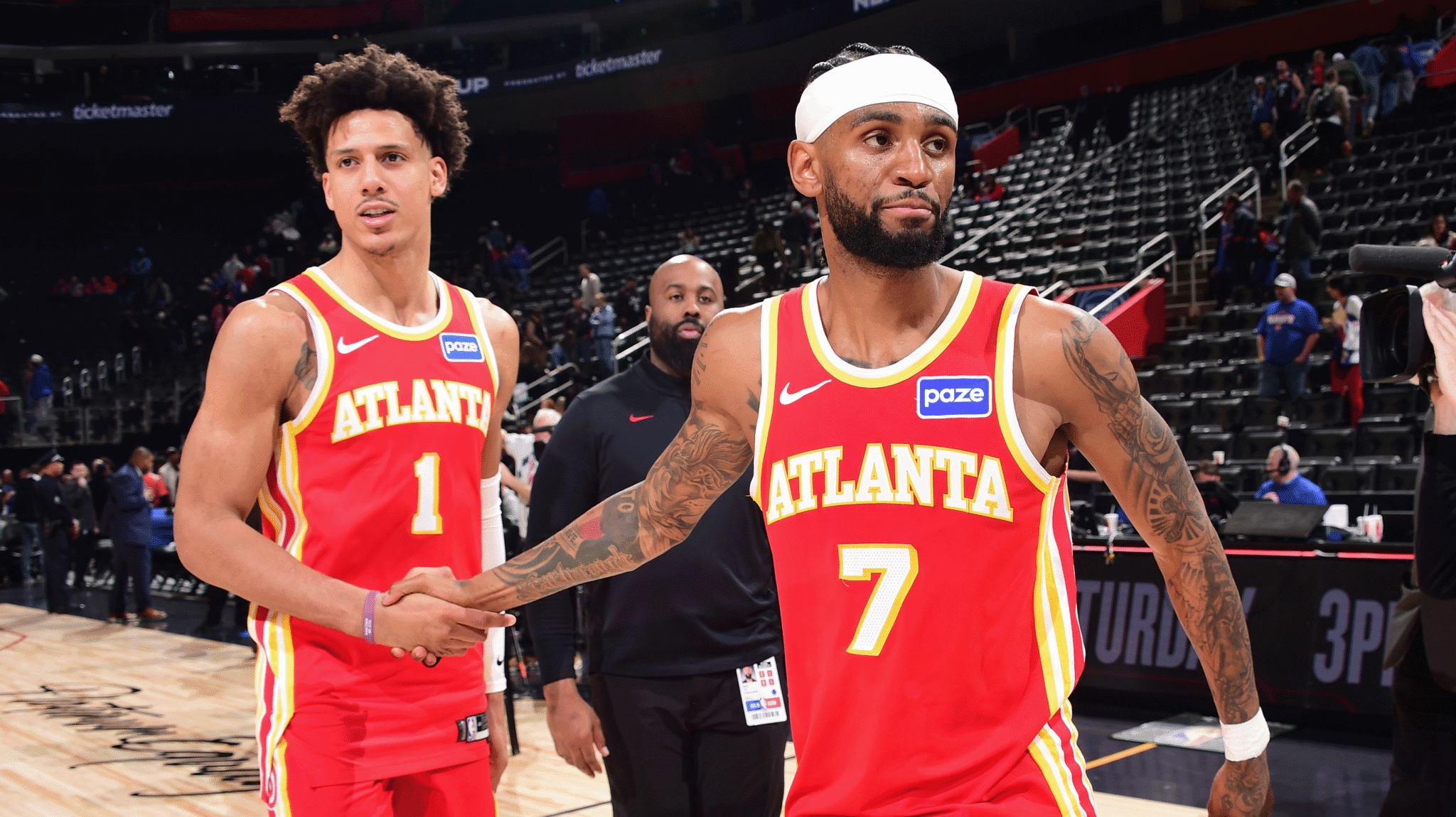 Atlanta Hawks stars Jalen Johnson and Nickeil Alexander-Walker in red and gold uniforms during the lead-up to the 2026–27 NBA season