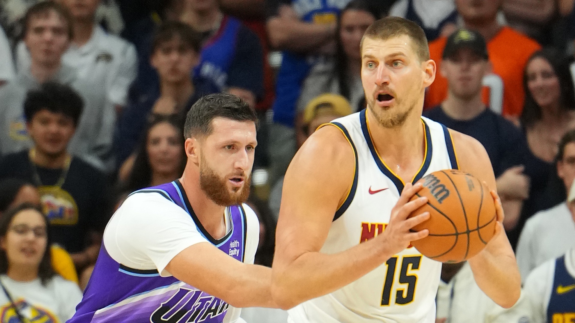 Jokić tosses a ridiculous no-look, behind-the-back pass to the opposite corner