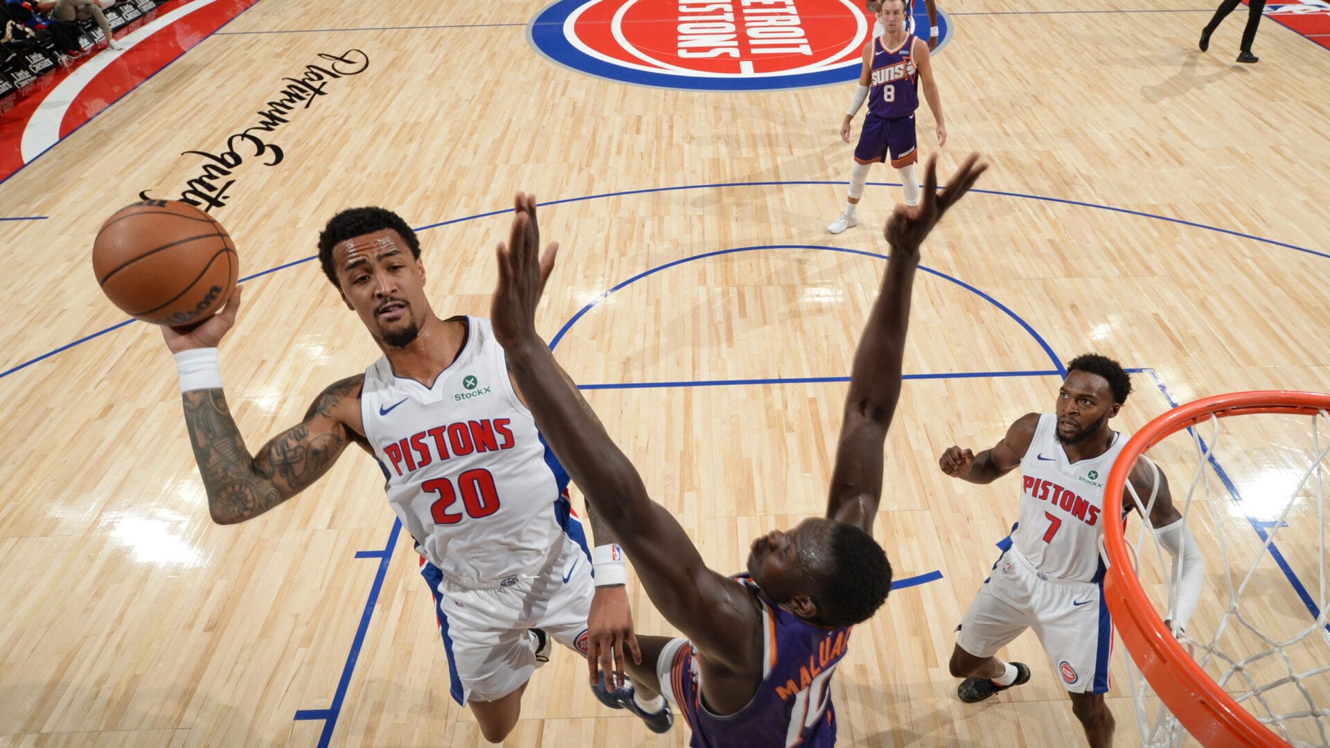 John Collins throws down reverse alley-oop jam