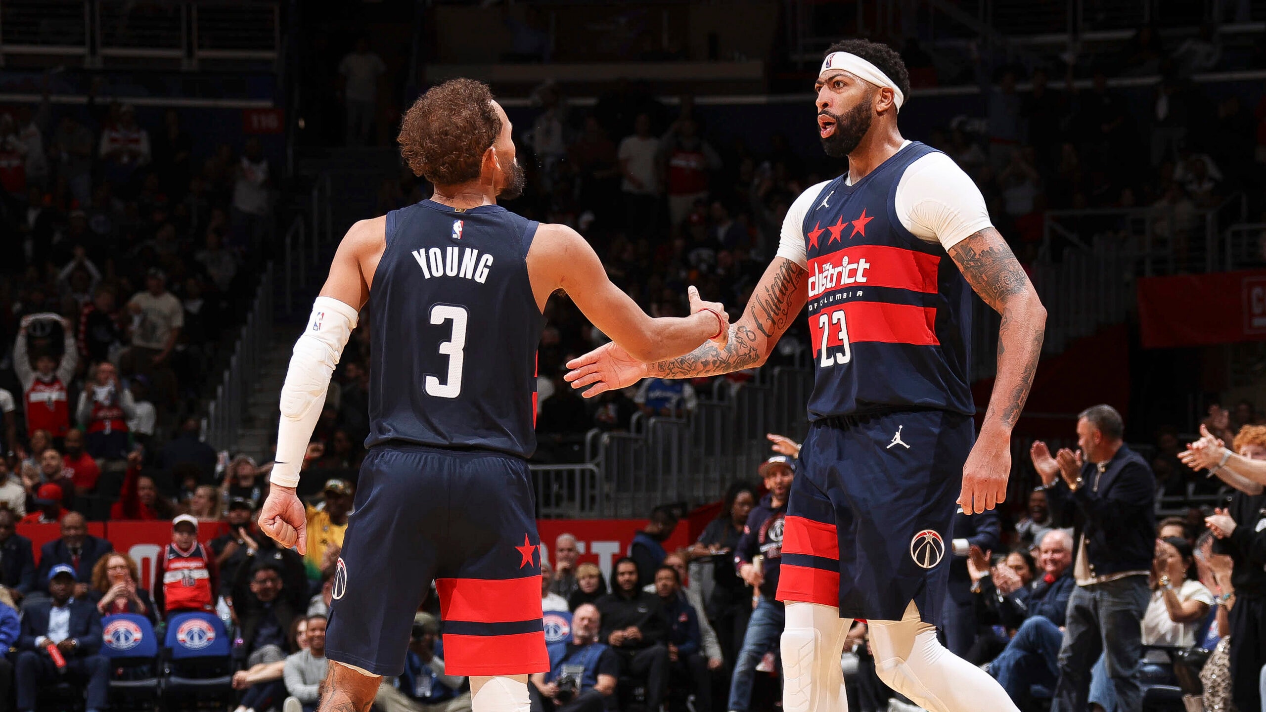 Wizards lean on their star duo to claim season opener