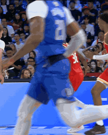 Cooper Flagg steals the ball and races the other way for a two-handed slam on the break.