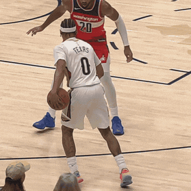Jeremiah Fears shakes the defender to toss an alley-oop to Yves Missi.