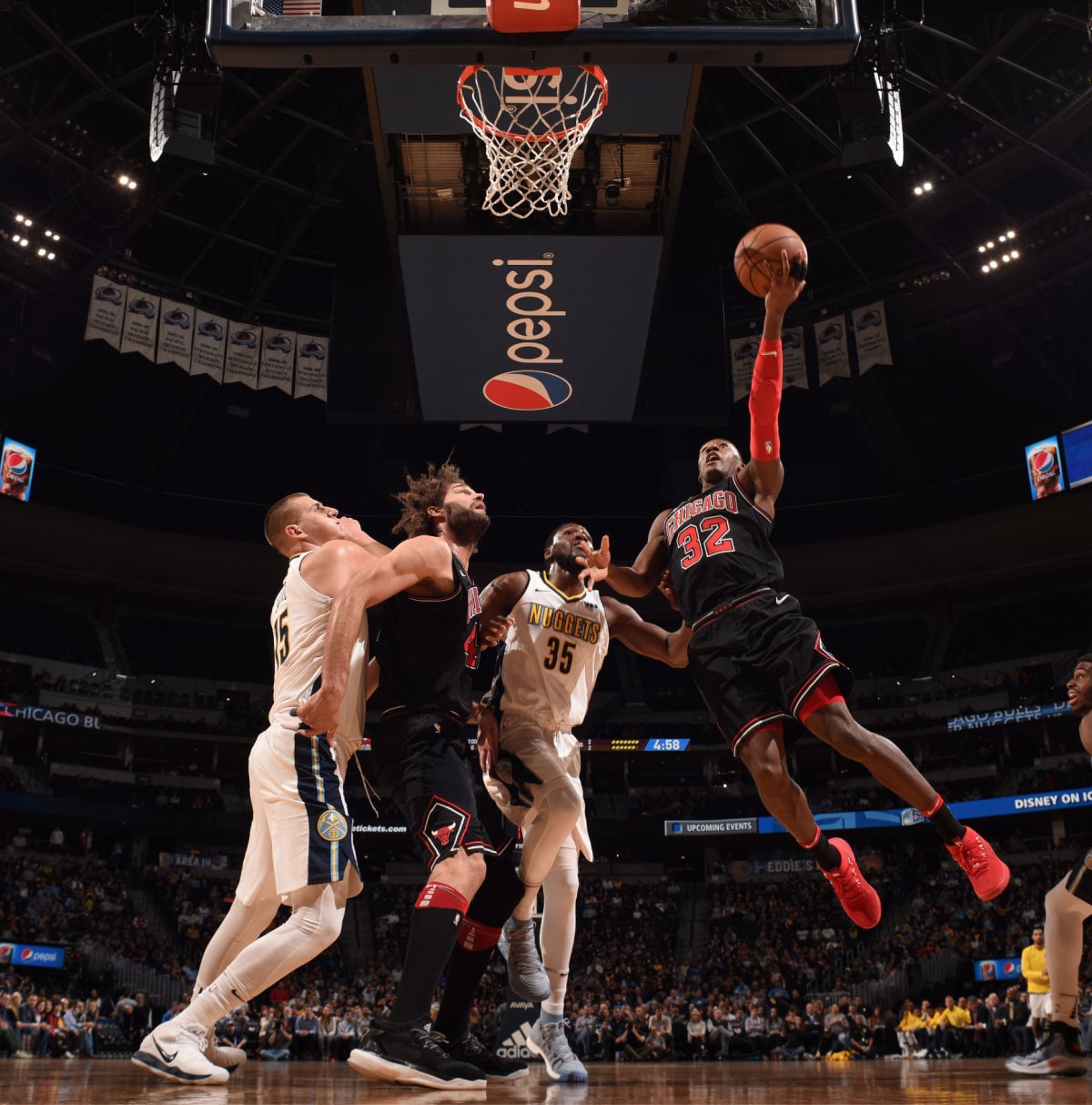 Kris Dunn shoots the ball against the Denver Nuggets, November 30, 2017 at the Pepsi Center, Denver, Colorado.