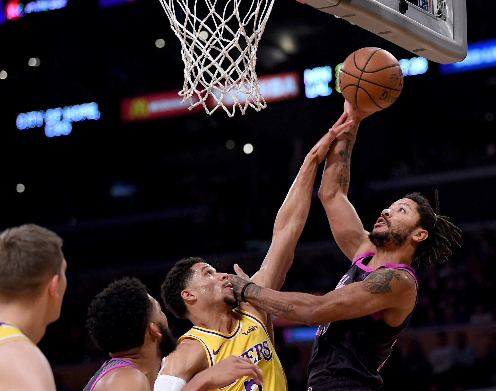 Derrick Rose #25 of the Minnesota Timberwolves attempts a shot over Josh Hart #3 of the Los Angeles Lakers during the first half at Staples Center on January 24, 2019 in Los Angeles, California.