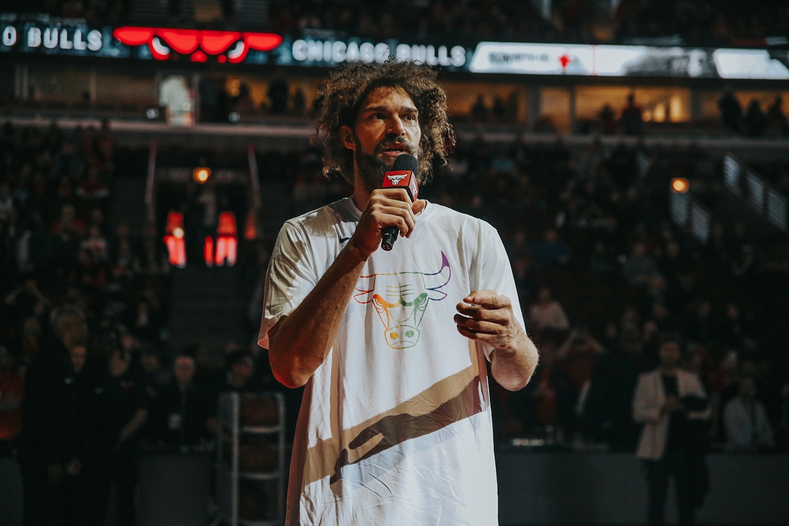 Robin Lopez speaks to the crowd before the start of a Bulls game.