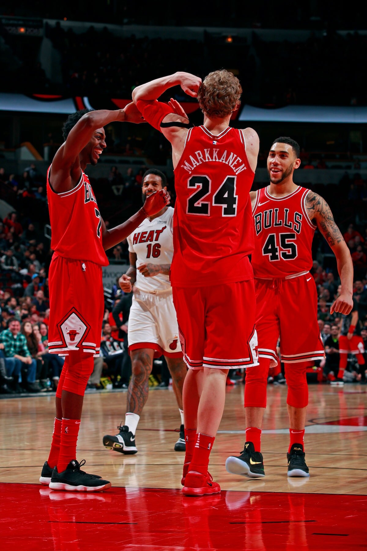 Lauri Markkanen #24 of the Chicago Bulls celebrates while flexing during the game against the Miami Heat on January 15, 2018 at the United Center in Chicago, Illinois