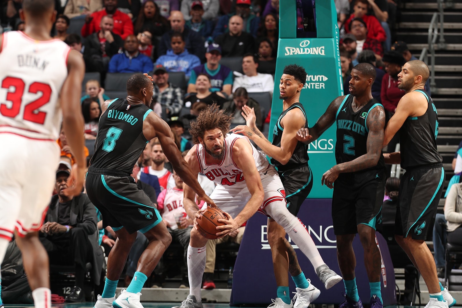 Robin Lopez Holds the Bulls amidst 3 Hornets players