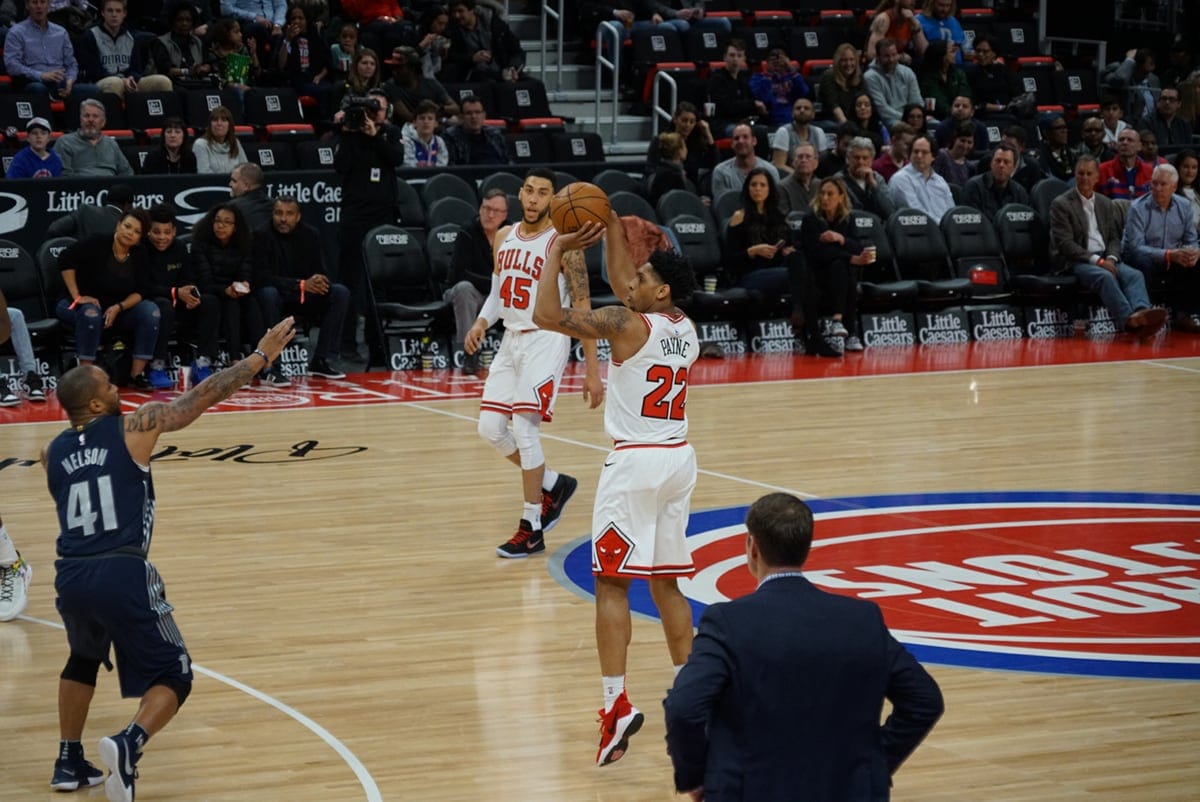 Cam Payne of the Chicago Bulls shoots a three vs the Pistons