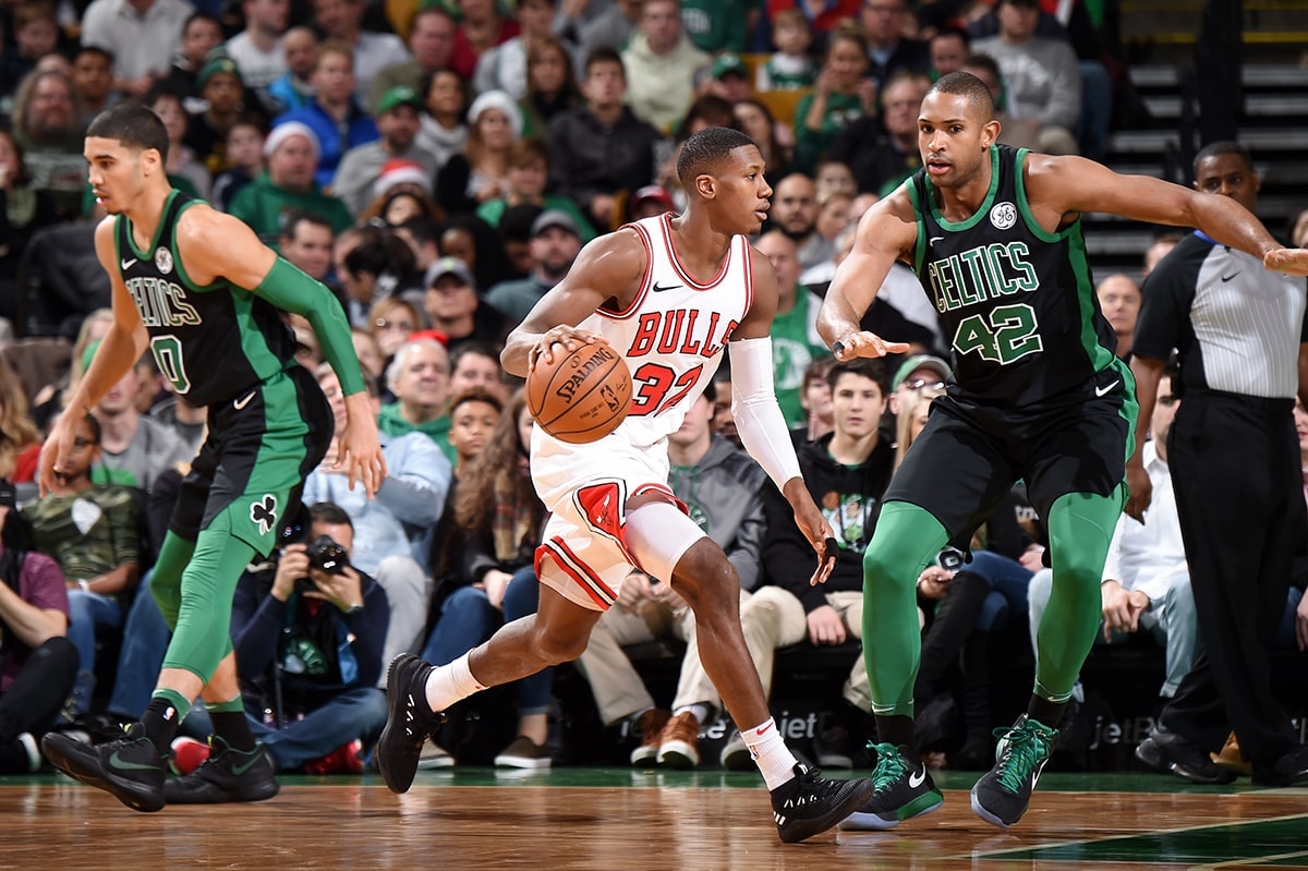 Kris Dunn #32 of the Chicago Bulls handles the ball against the Boston Celtics on December 23, 2017 at the TD Garden in Boston, Massachusetts.