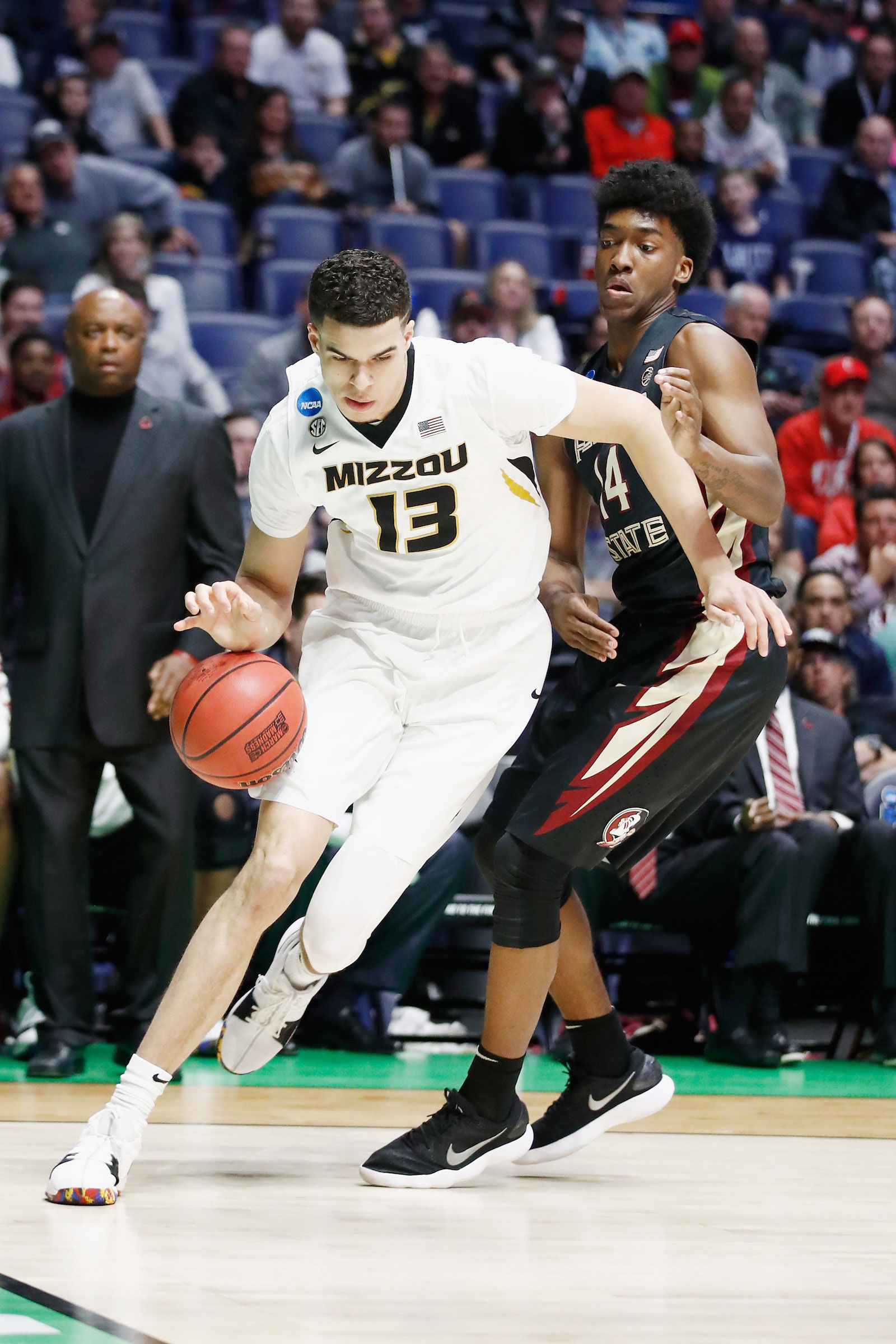 Michael Porter Jr. #13 of the Missouri Tigers drives to the basket against Terance Mann #14 of the Florida State Seminoles during the game in the first round of the 2018 NCAA Men's Basketball Tournament at Bridgestone Arena on March 16, 2018 in Nashville, Tennessee.