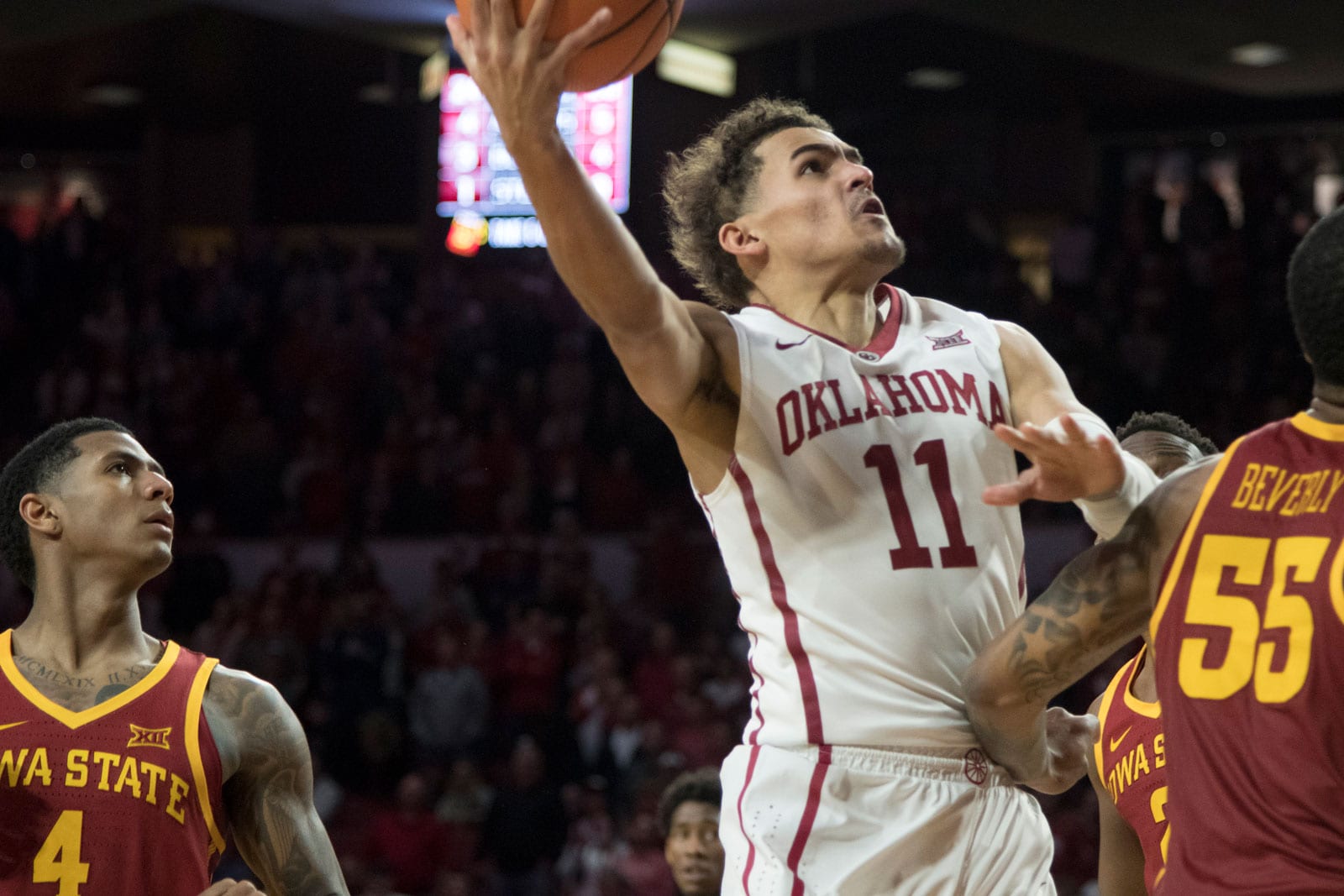 Oklahoma Sooners guard Trae Young #11 shoots over an Iowa State player during the second half of a NCAA college basketball game at the Lloyd Noble Center on March 2, 2018 in Norman, Oklahoma.