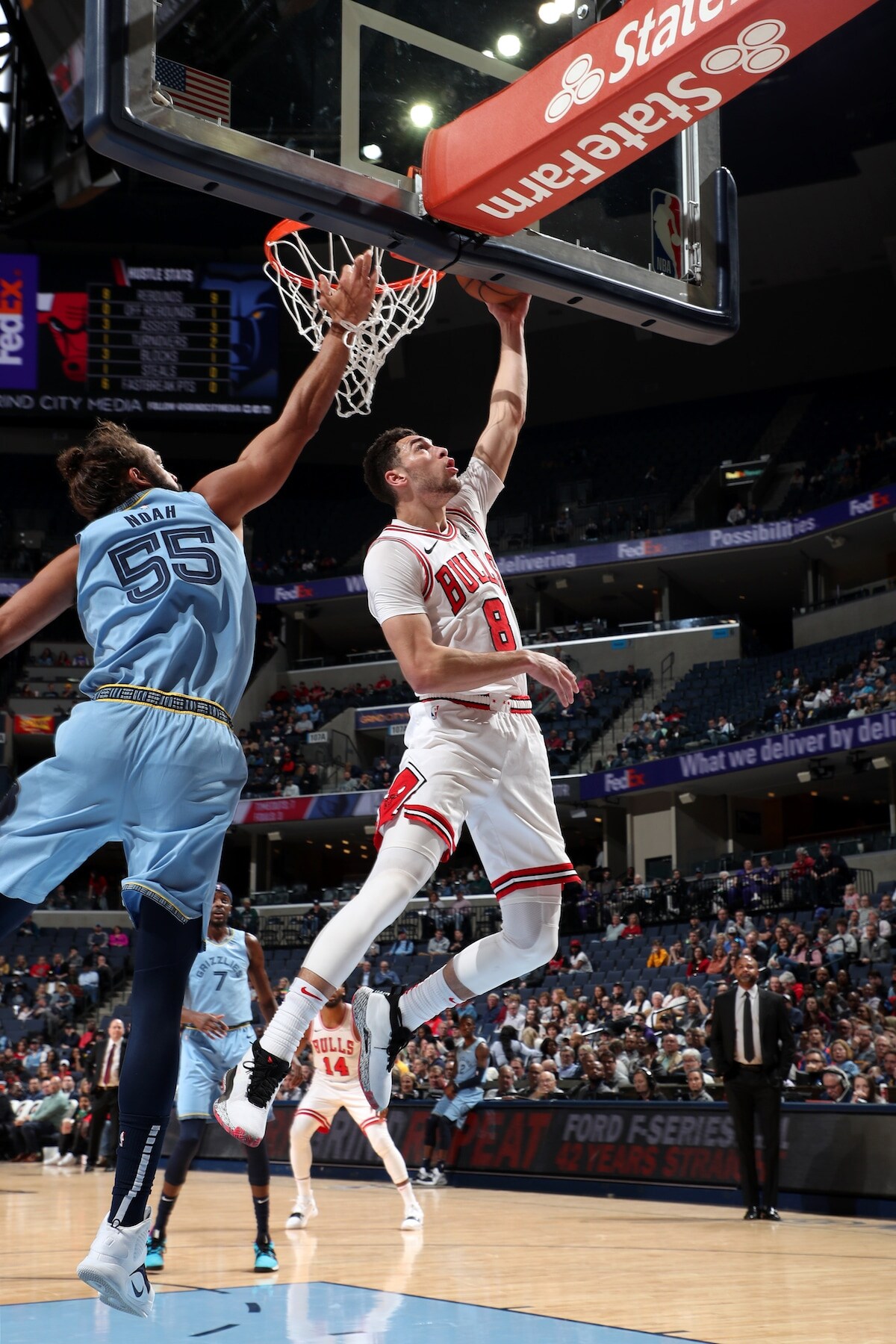 Zach LaVine goes for the layup against Joakim Noah of the Memphis Grizzlies