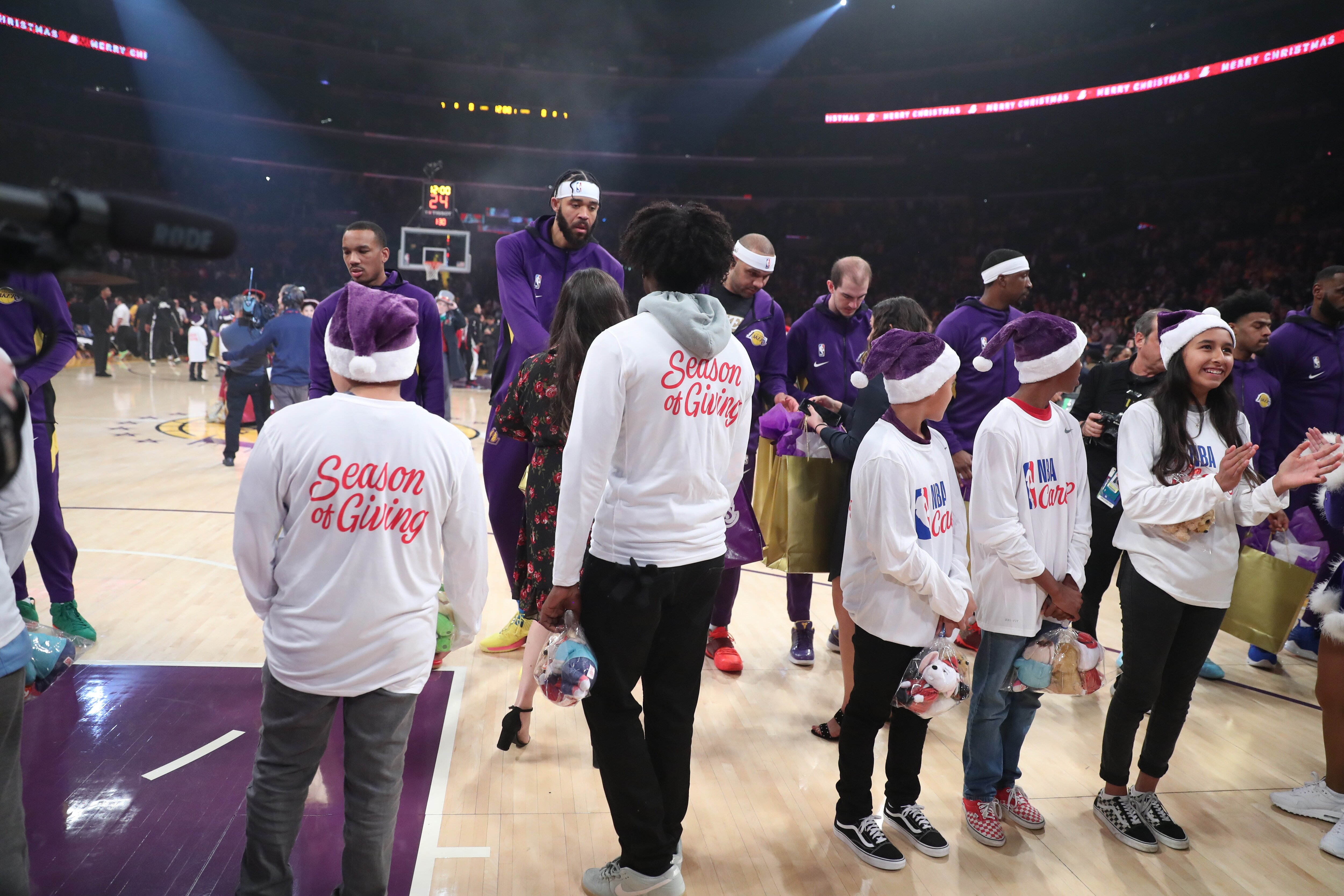 Slideshow-image: Lakers On-Court Gift Exchange for NBA Cares Season of Giving 19-20...