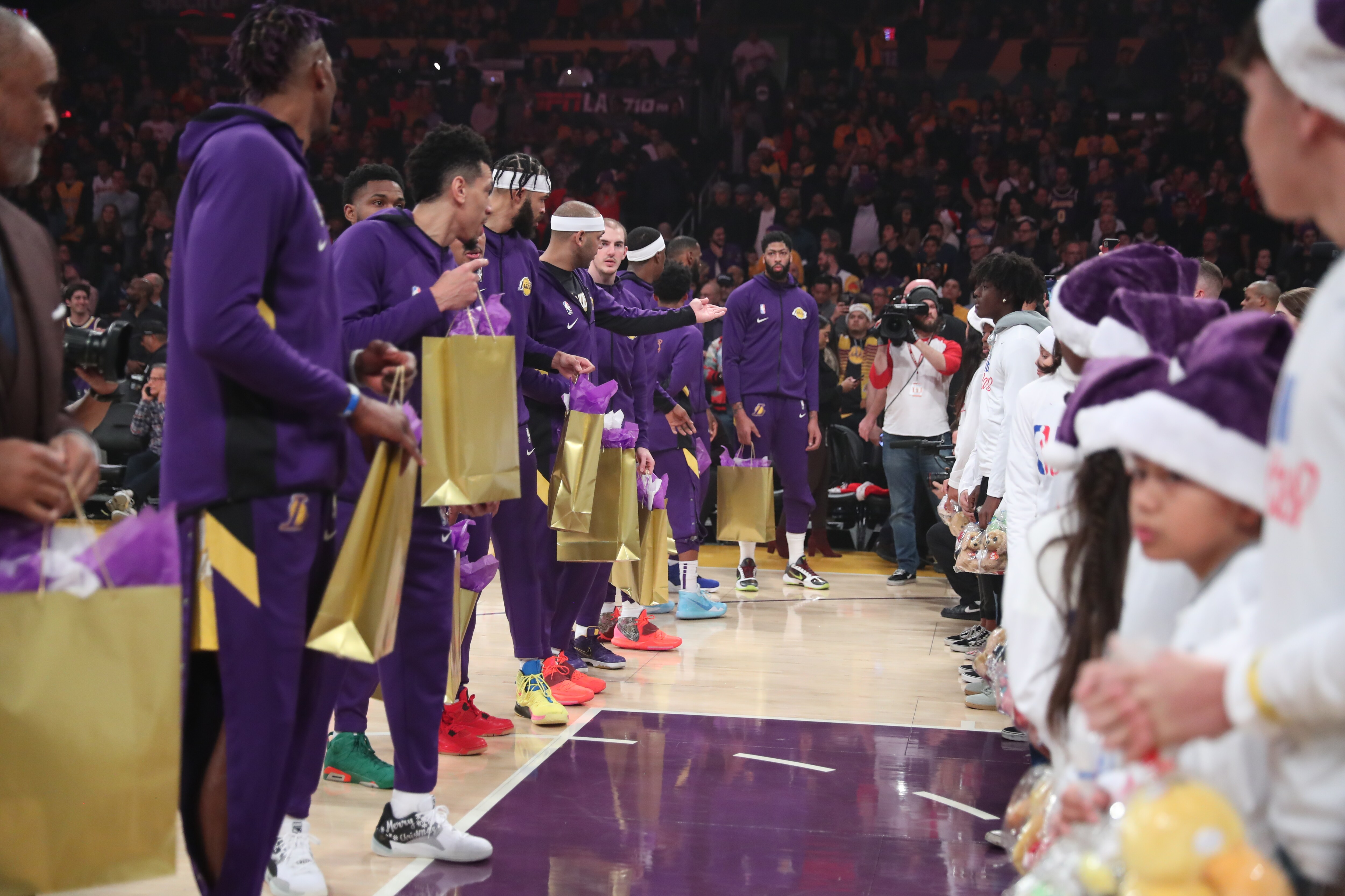 Slideshow-image: Lakers On-Court Gift Exchange for NBA Cares Season of Giving 19-20...