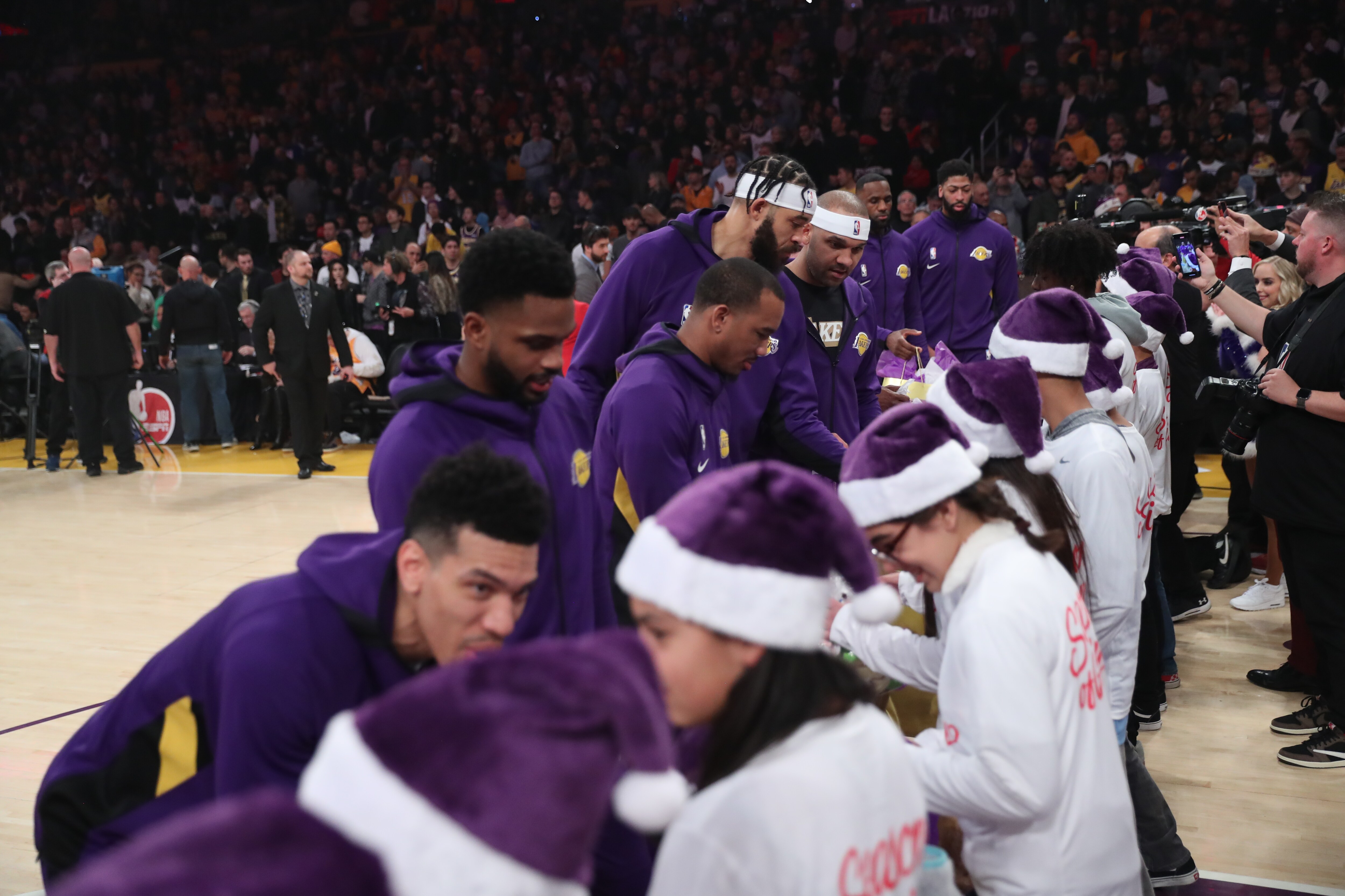 Slideshow-image: Lakers On-Court Gift Exchange for NBA Cares Season of Giving 19-20...