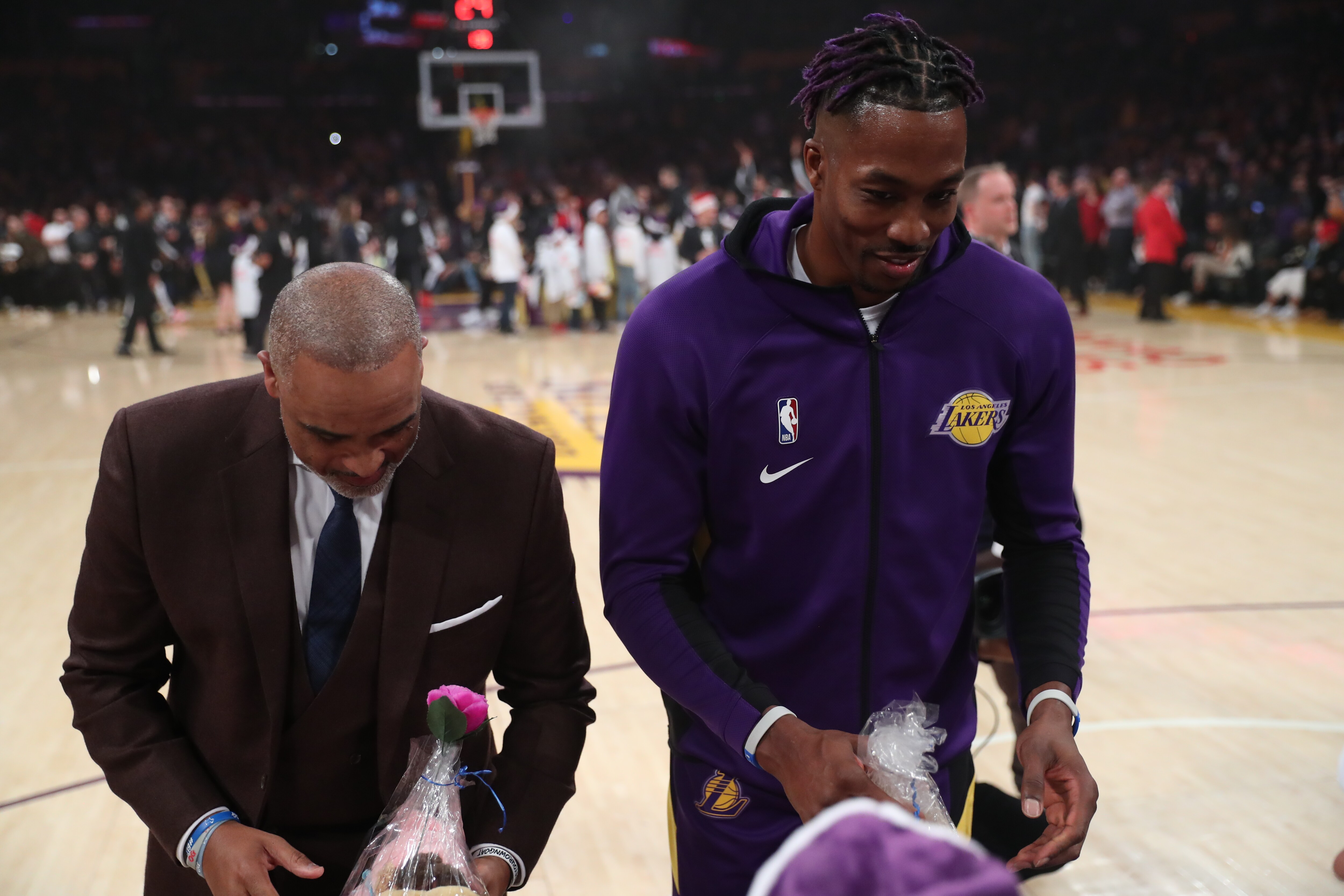 Slideshow-image: Lakers On-Court Gift Exchange for NBA Cares Season of Giving 19-20...