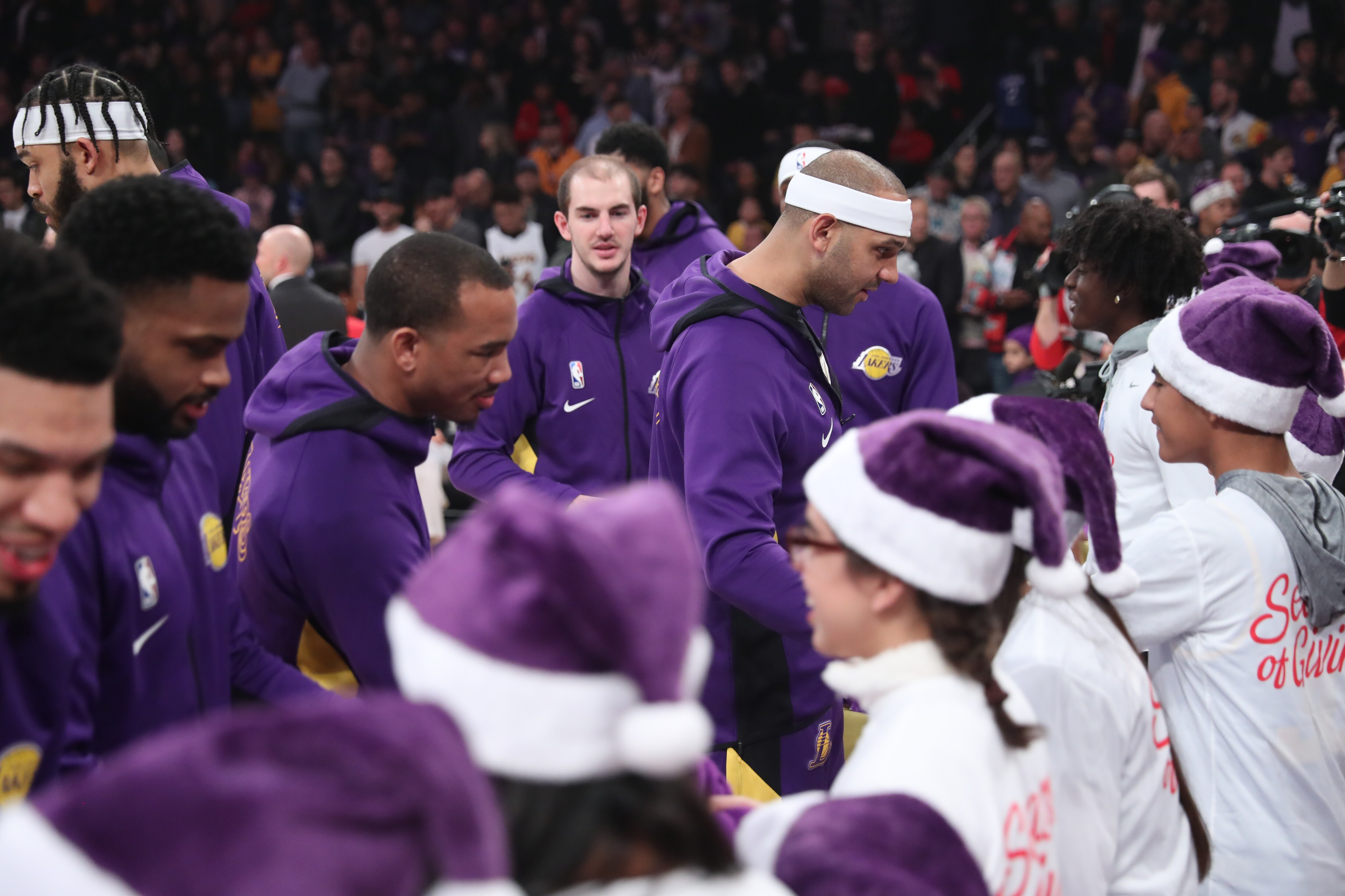 Slideshow-image: Lakers On-Court Gift Exchange for NBA Cares Season of Giving 19-20...