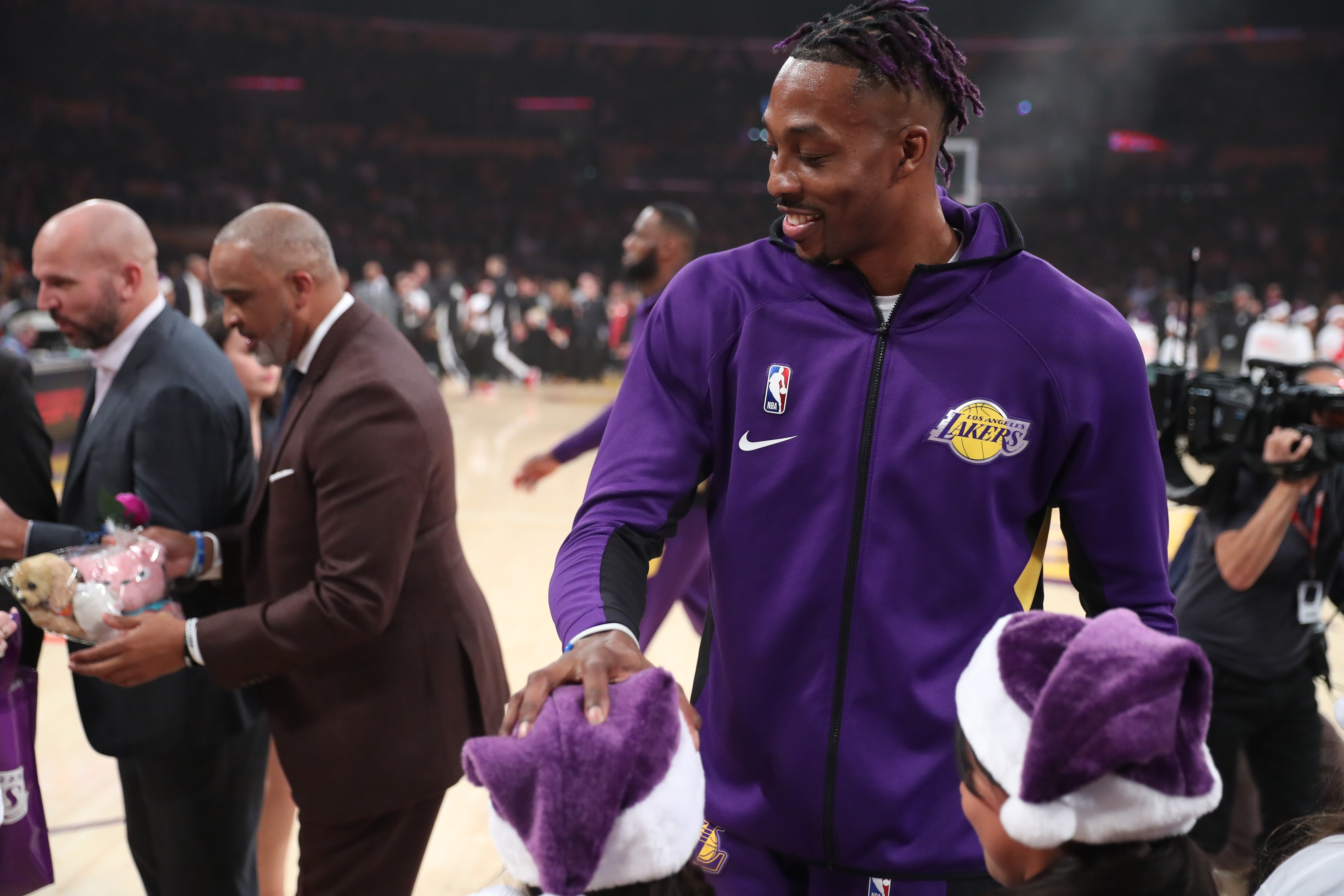 Slideshow-image: Lakers On-Court Gift Exchange for NBA Cares Season of Giving 19-20...