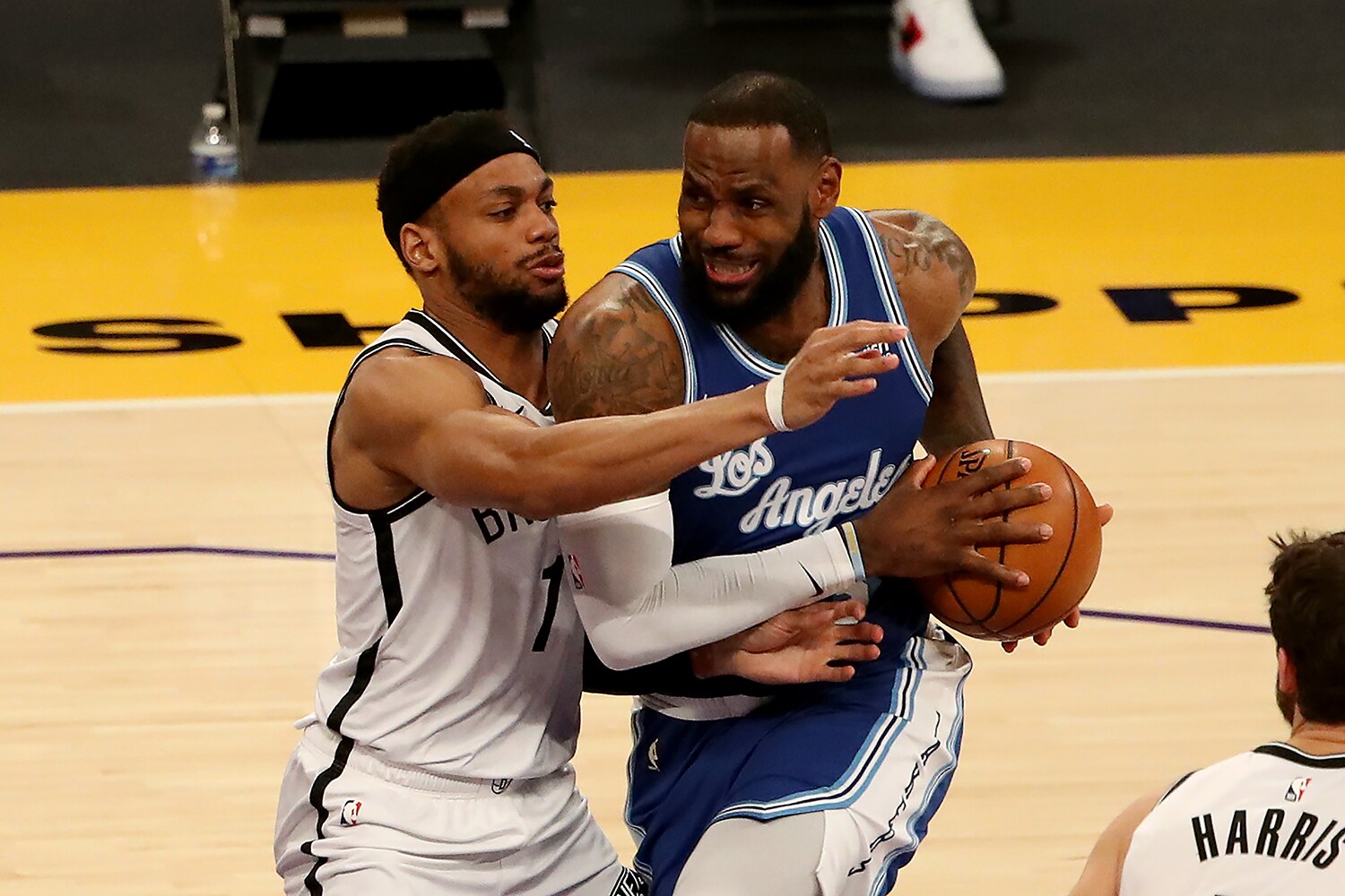 LOS ANGELES, CALIFORNIA - FEBRUARY 18: LeBron James #23 of the Los Angeles Lakers drives to the basket against Bruce Brown #1 of the Brookly