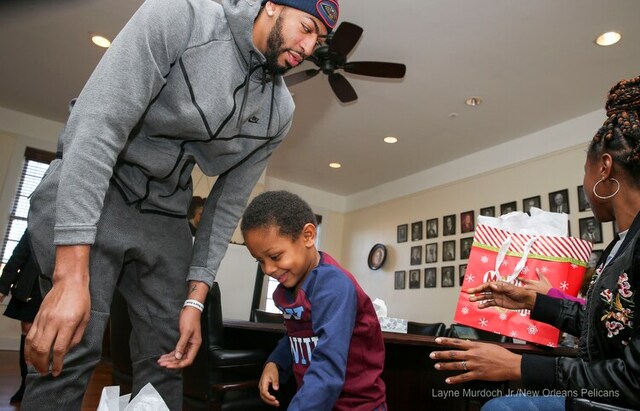 Slideshow-image: Anthony Davis of the New Orleans Pelicans surprises a local family at Kingsley House and gives away a car on December 12, 2017....