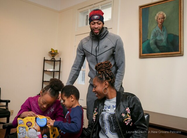 Slideshow-image: Anthony Davis of the New Orleans Pelicans surprises a local family at Kingsley House and gives away a car on December 12, 2017....