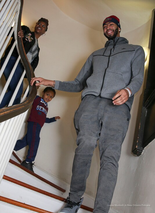 Slideshow-image: Anthony Davis of the New Orleans Pelicans surprises a local family at Kingsley House and gives away a car on December 12, 2017....