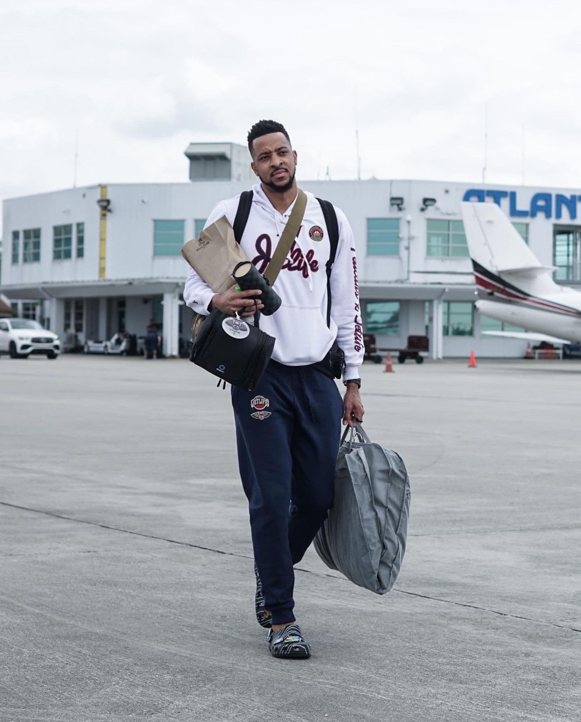 The New Orleans Pelicans board their plane to Los Angeles.
