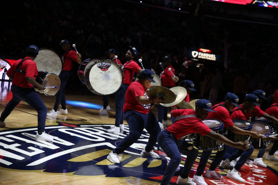 Slideshow-image: Fans are entertained by marching bands, the Pelicans drumline and Hype Team during Friday night's matchup against the Charlotte Hornets on March 11...