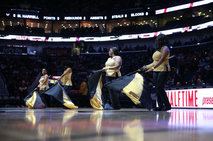 Slideshow-image: Fans are entertained by marching bands, the Pelicans drumline and Hype Team during Friday night's matchup against the Charlotte Hornets on March 11...