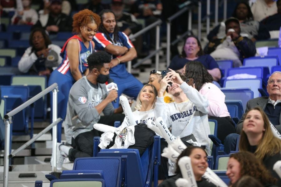 Lightbox-image: Watch New Orleans fans as they're entertained by the Hype Team, Drumline, halftime performance, and more during the Pelicans game against the Orlan...