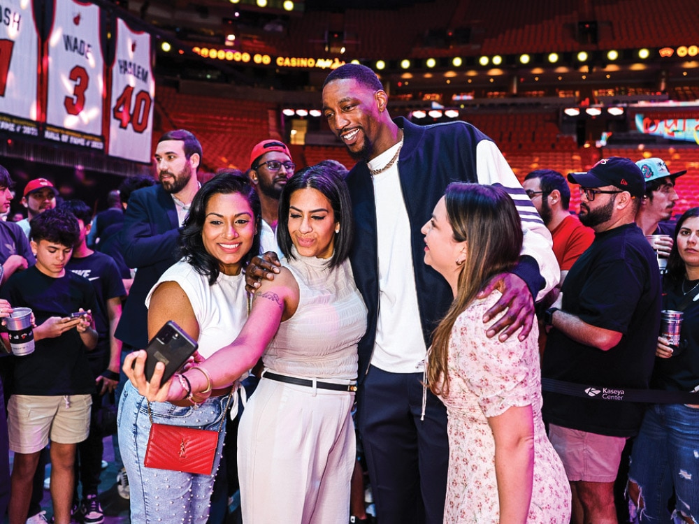 Adebayo taking a photo with fans at a Season Ticket Member event - Ticket Plans
