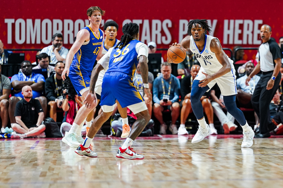Johnson lives up to hype, as does his ex-teammate, as Mavericks drop summer opener