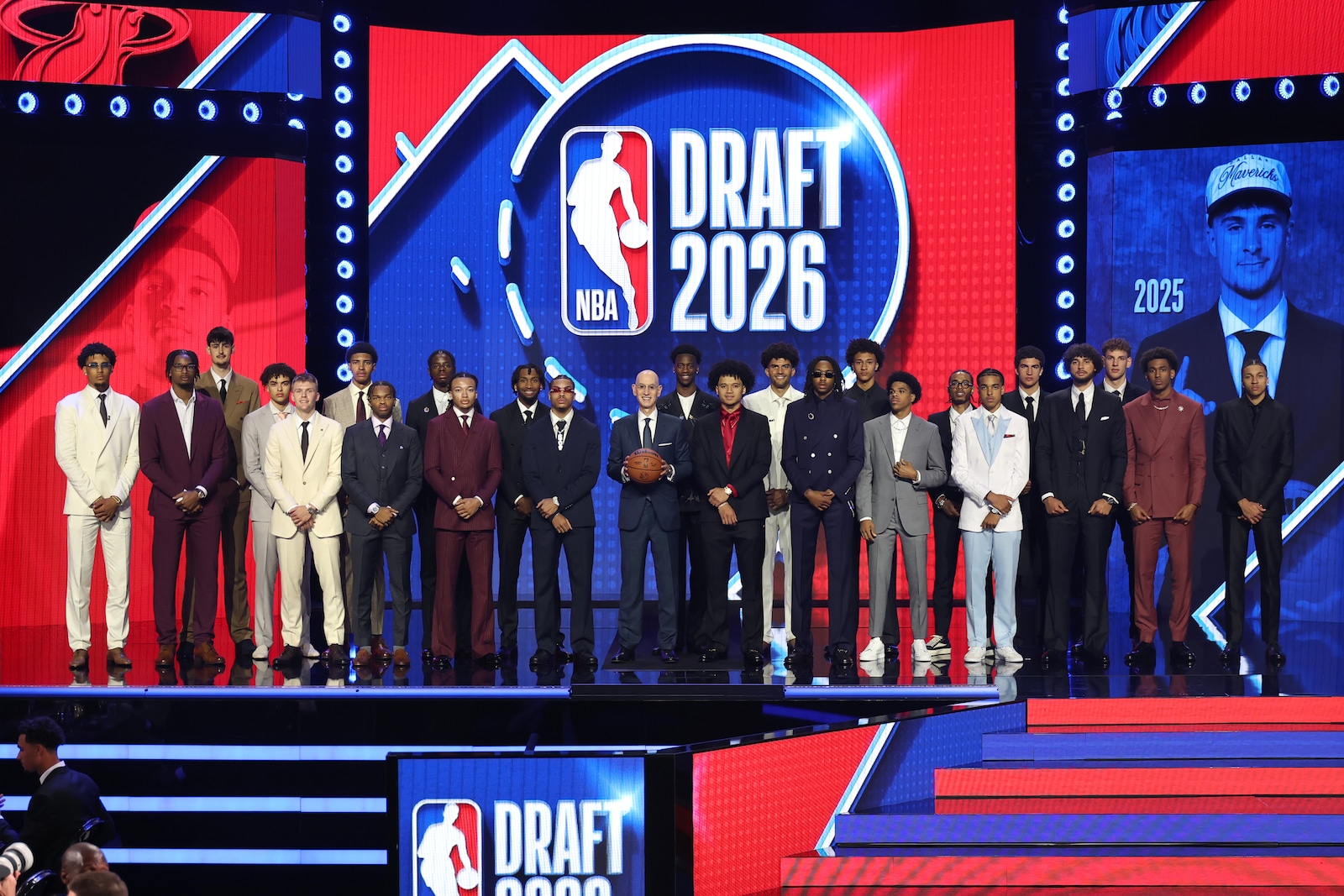 Slideshow-image: BROOKLYN, NY - JUNE 23: NBA Commissioner Adam Silver poses with the 2026 NBA Draft prospects for a portrait before the 2026 NBA Draft - Round One o...