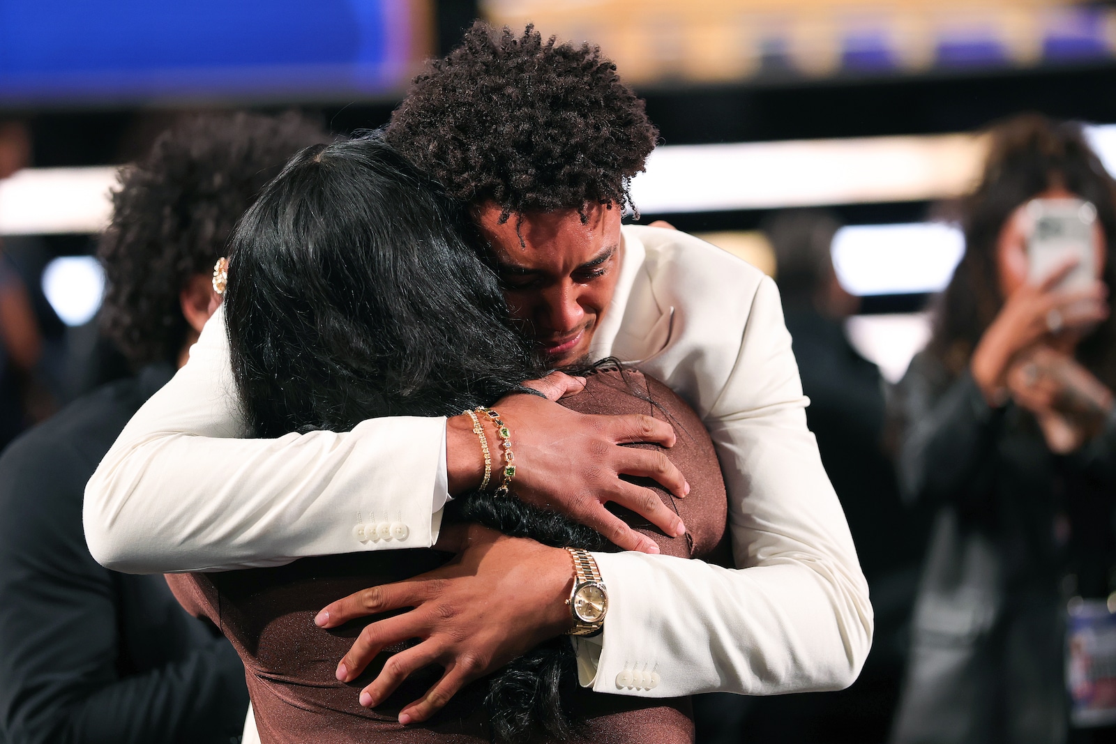 Slideshow-image: NEW YORK, NEW YORK - JUNE 23:  Yaxel Lendeborg celebrates with his mother Yissel Raposo after is drafted eleventh overall by the Golden State Warri...