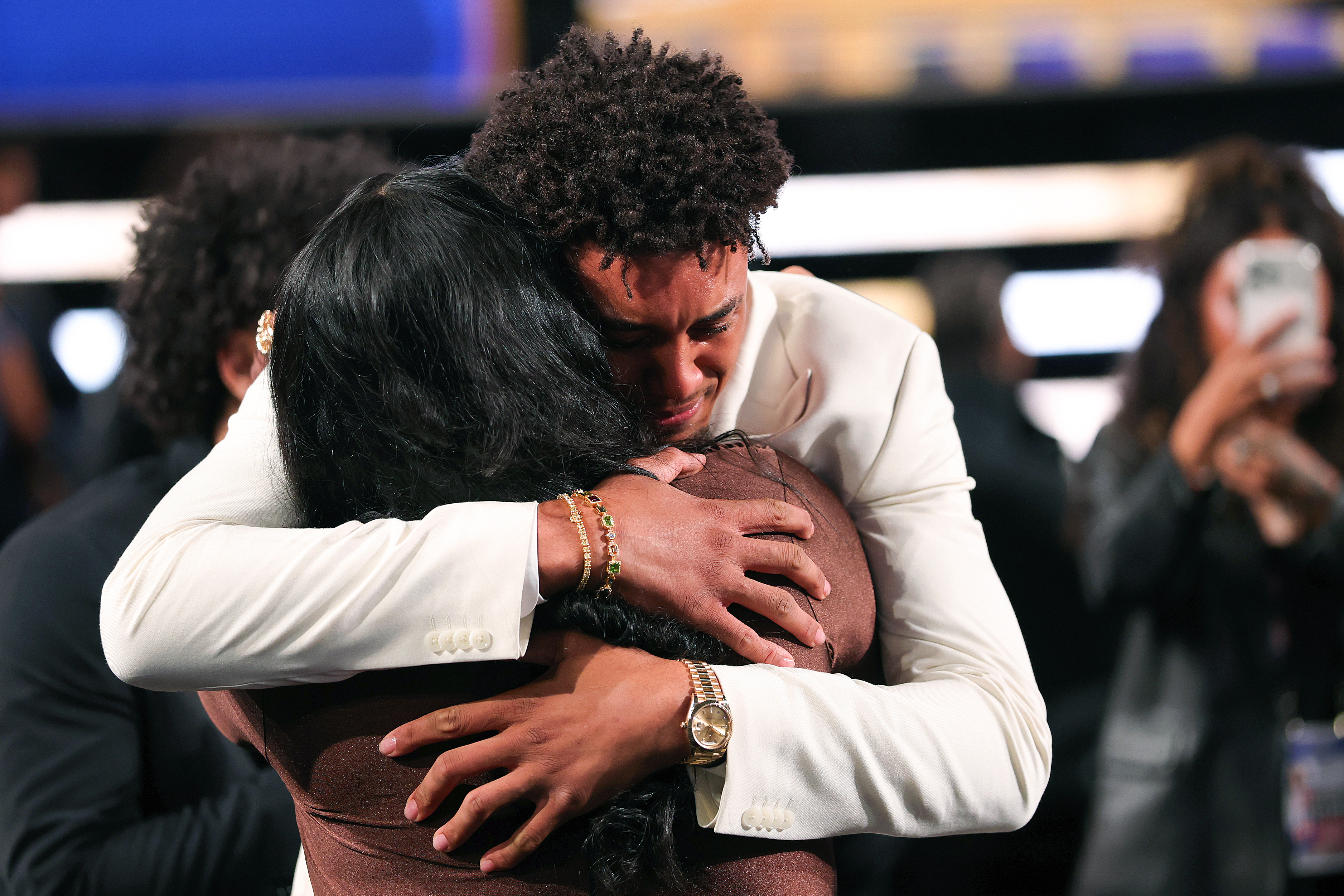 Slideshow-image: NEW YORK, NEW YORK - JUNE 23: Yaxel Lendeborg celebrates with his mother Yissel Raposo after is drafted eleventh overall by the Golden State Warri...