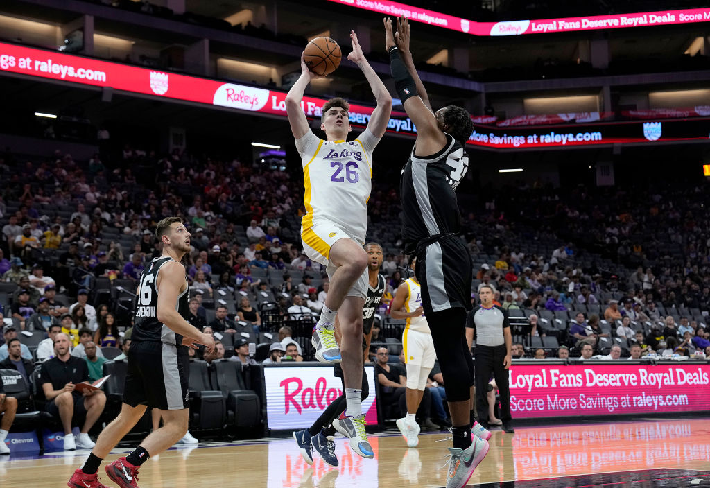 Slideshow-image: SACRAMENTO, CALIFORNIA - JULY 05: Colin Castleton #26 of the Los Angeles Lakers shoots over Josh Carlton #4 the San Antonio Spurs in the first half...