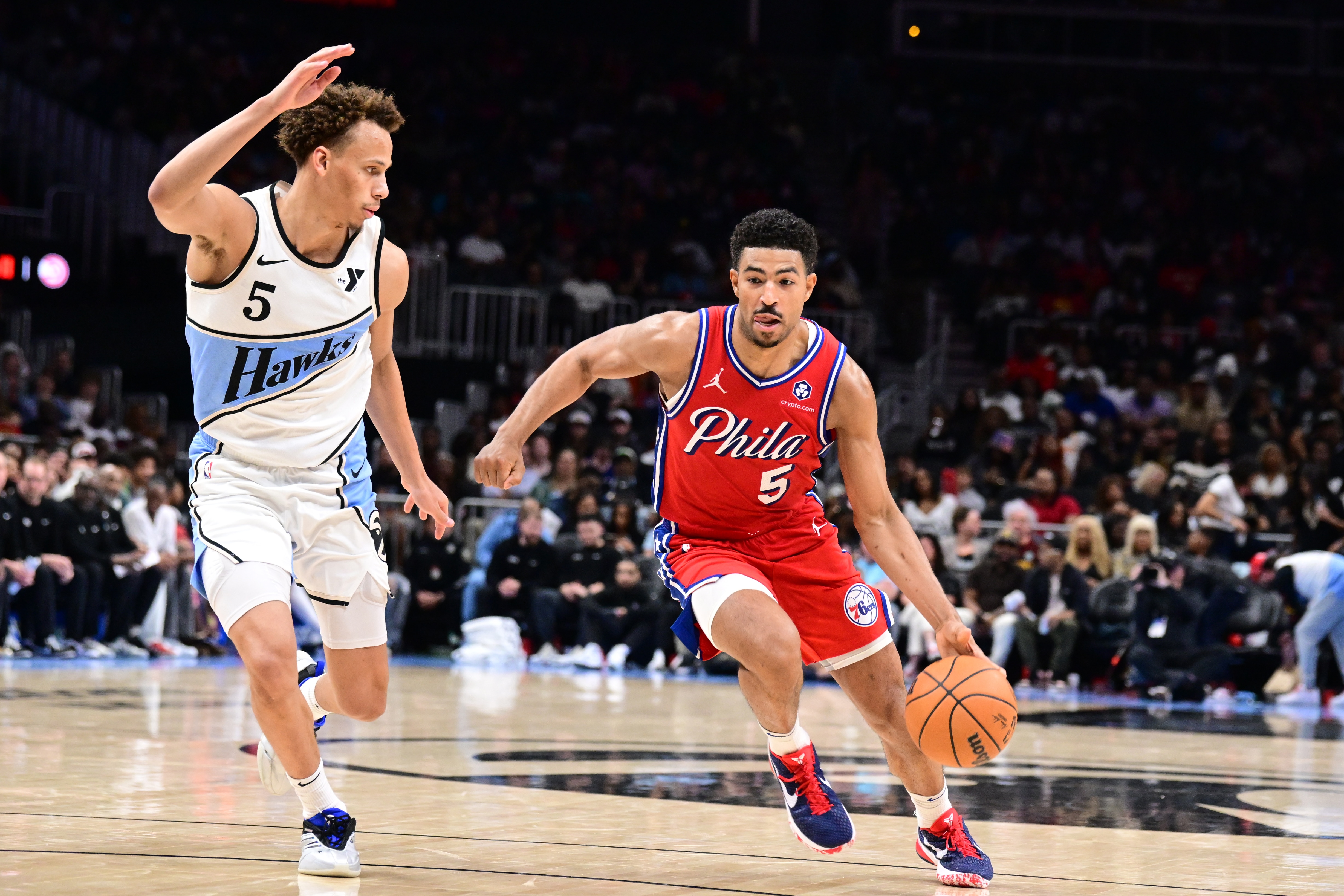 Quentin Grimes #5 of the Philadelphia 76ers dribbles around defender