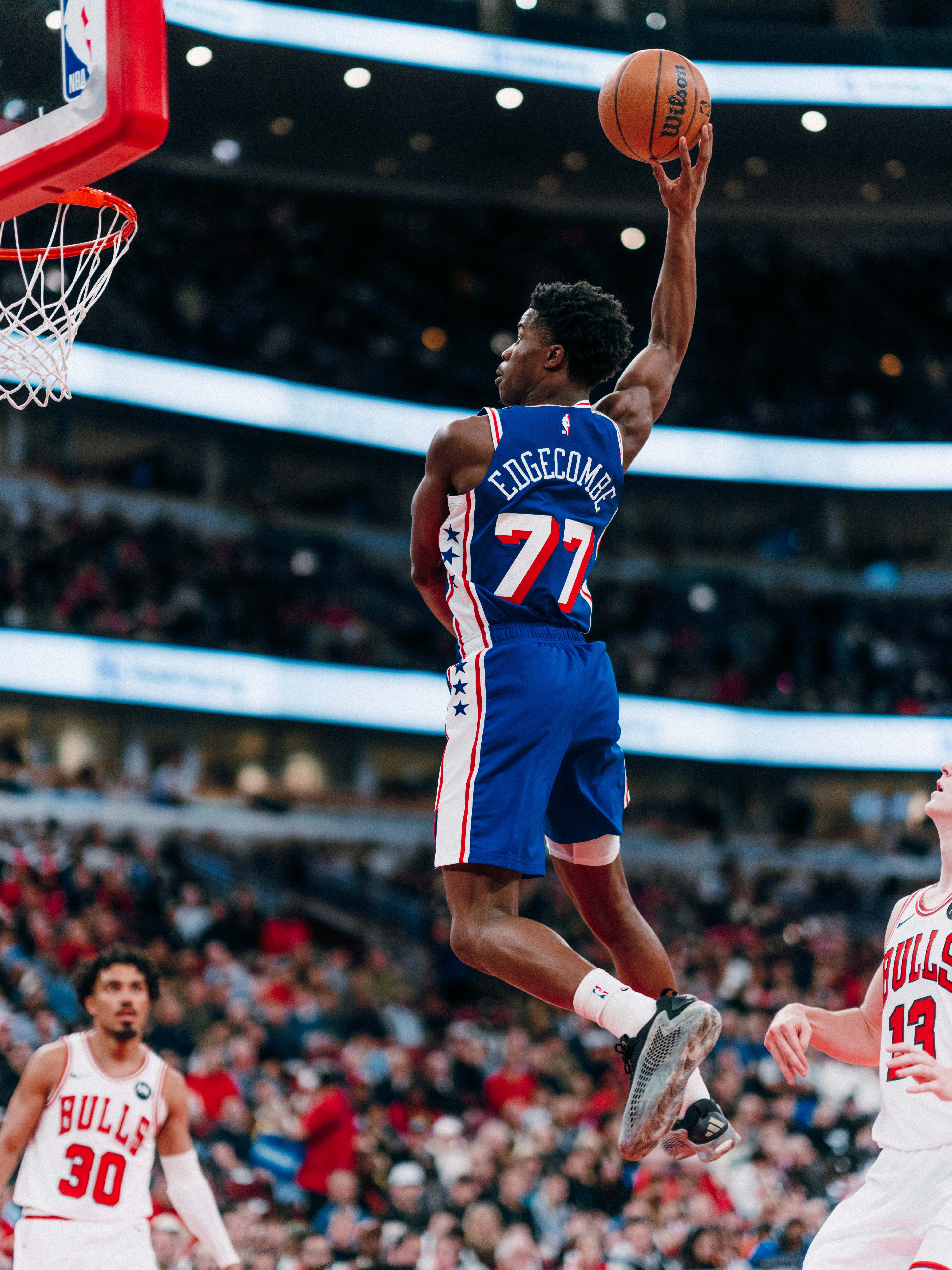 VJ Edgecombe #77 flying through the air for 1-handed dunk