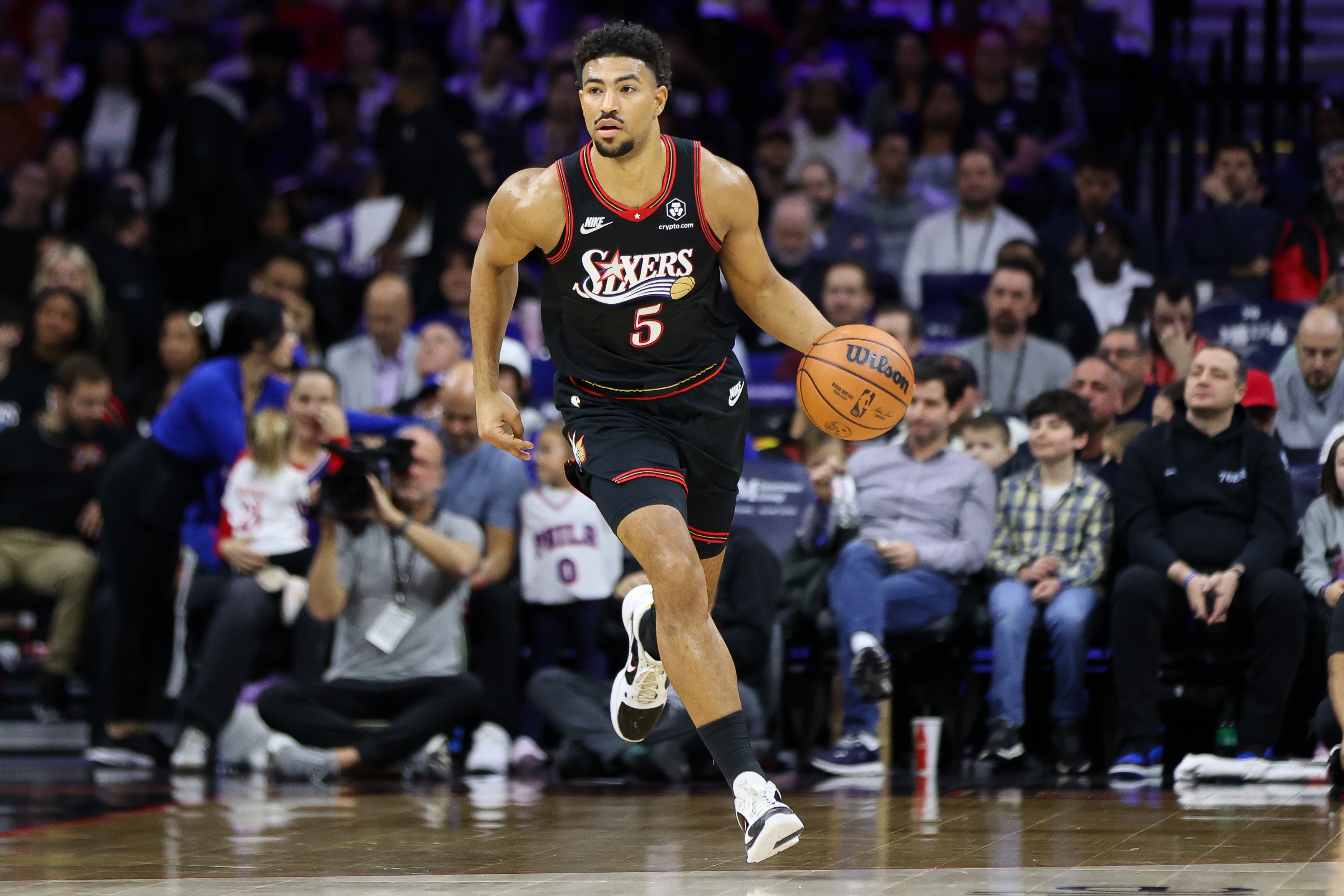 Quentin Grimes #5 of the Philadelphia 76ers dribbles against the Miami Heat