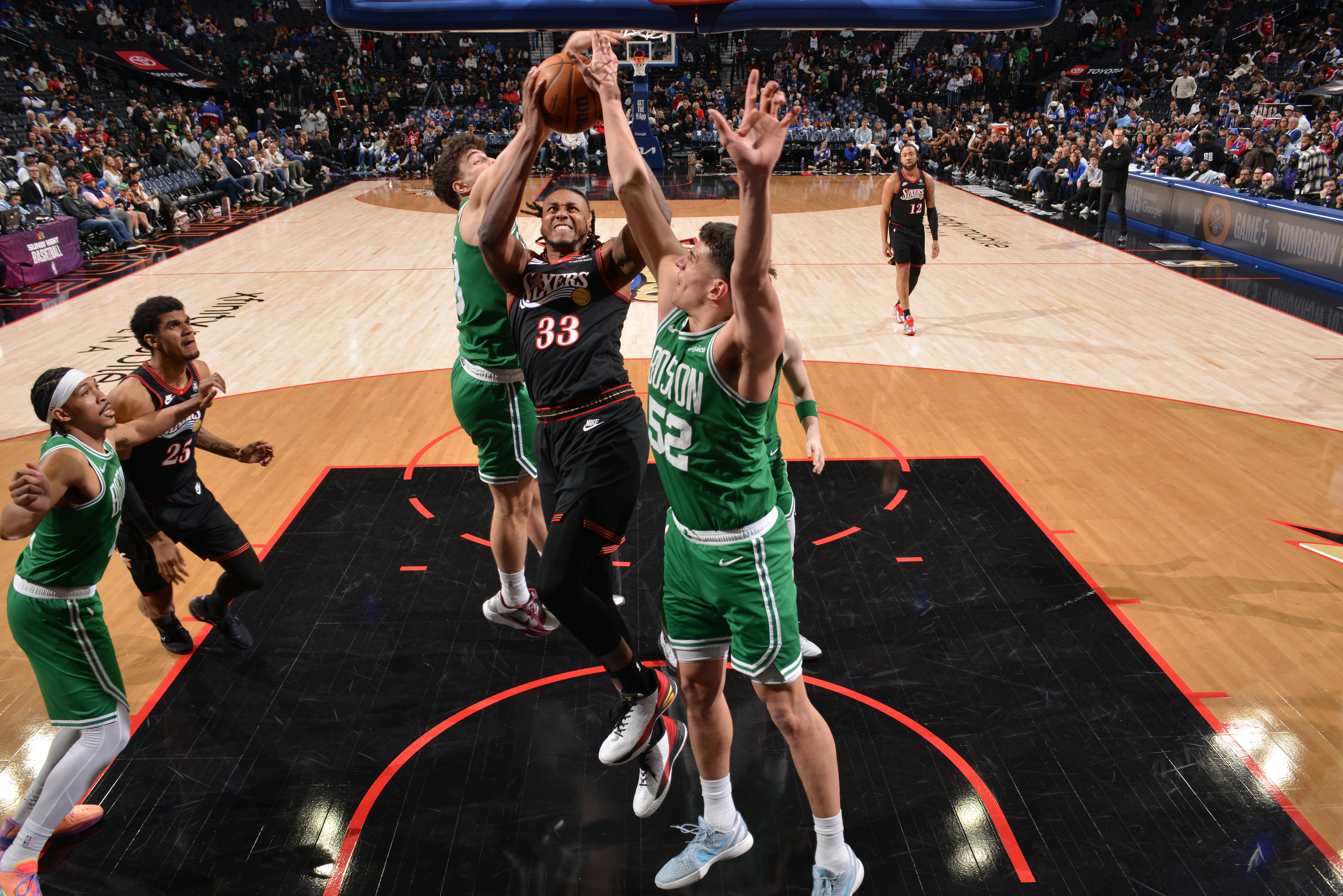 Jabari Walker #33 of the Philadelphia 76ers drives to the basket during the game